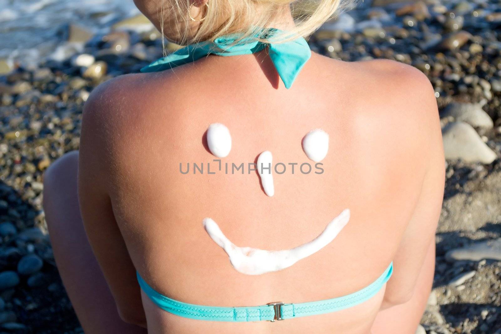 sun protection cream on her back by gurin_oleksandr