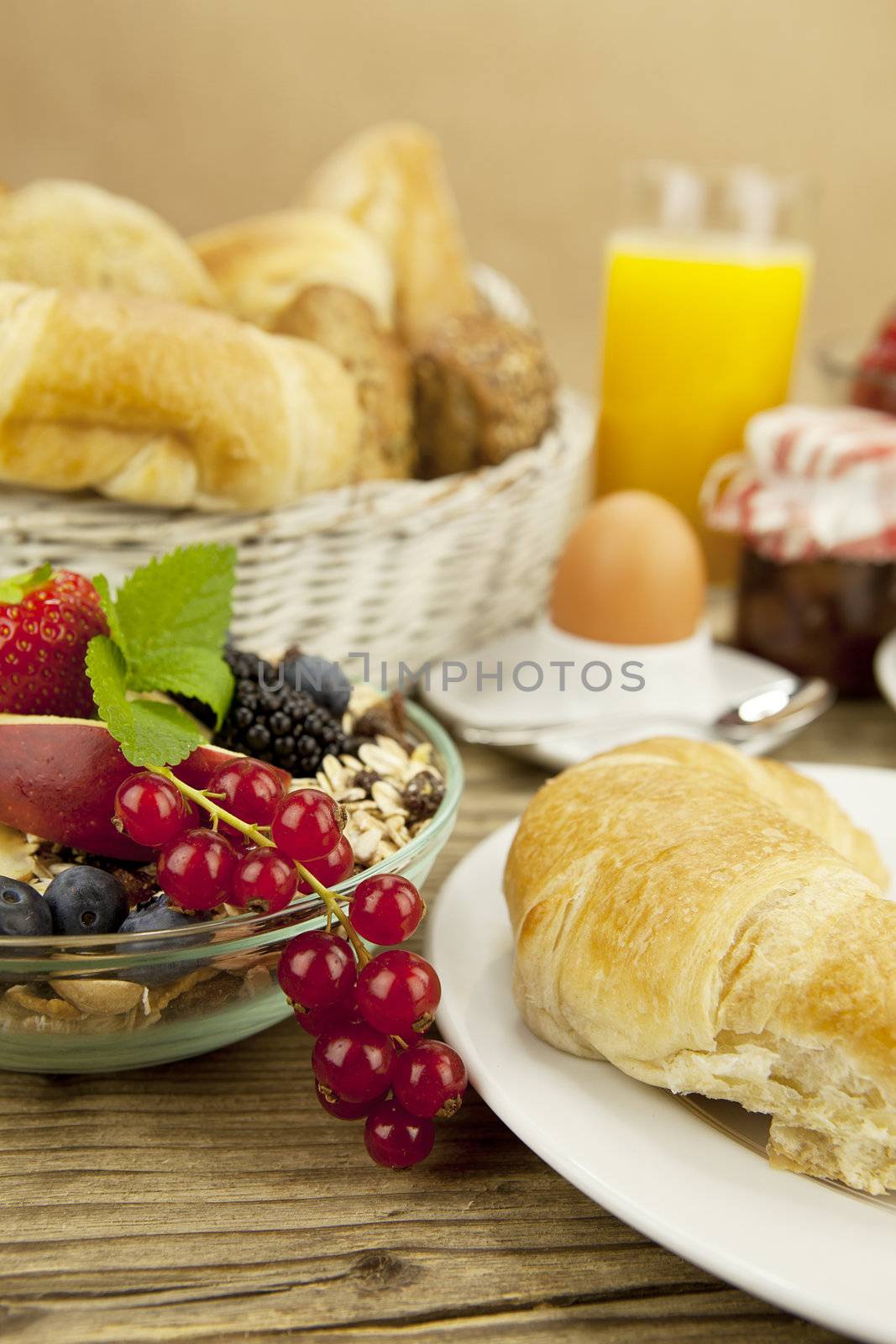 traditional french breakfast in morning on wooden background