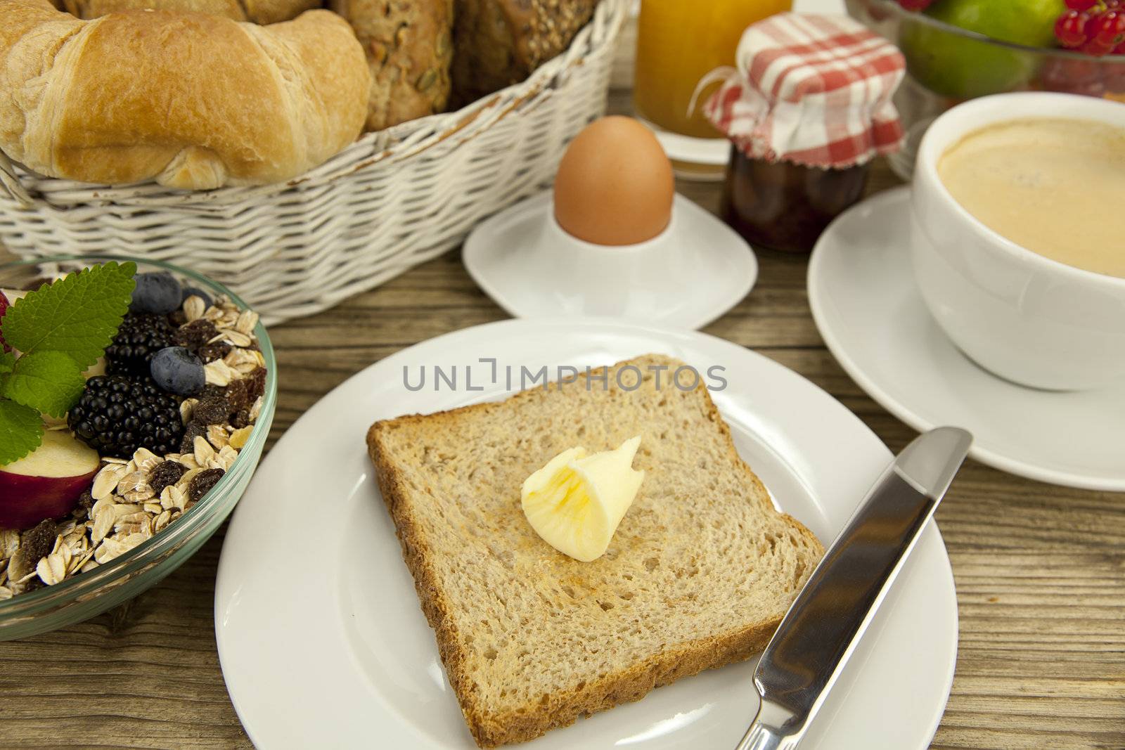 traditional french breakfast in morning on wooden background