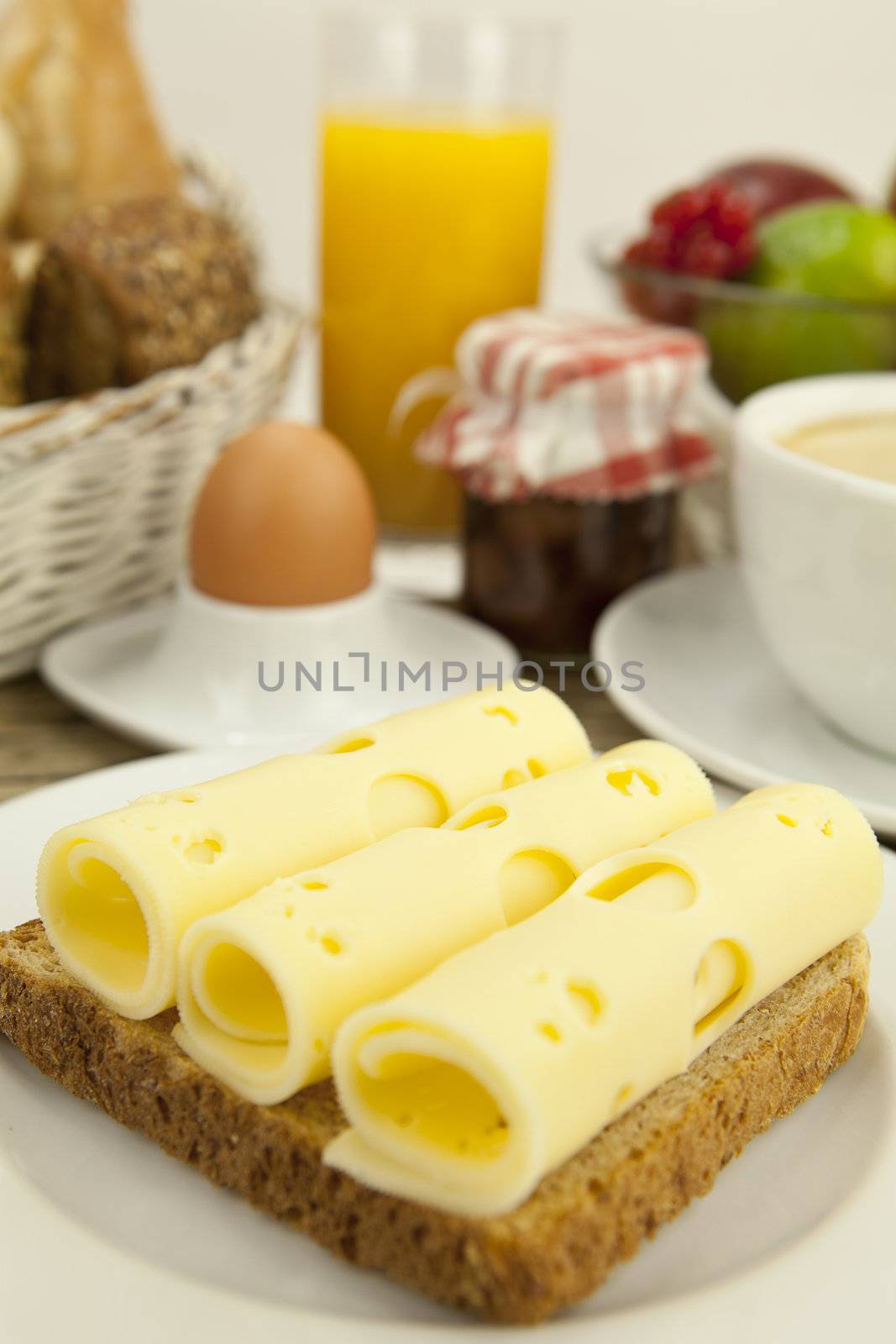breakfast in morning with fruits  cheese toast coffee on wooden table