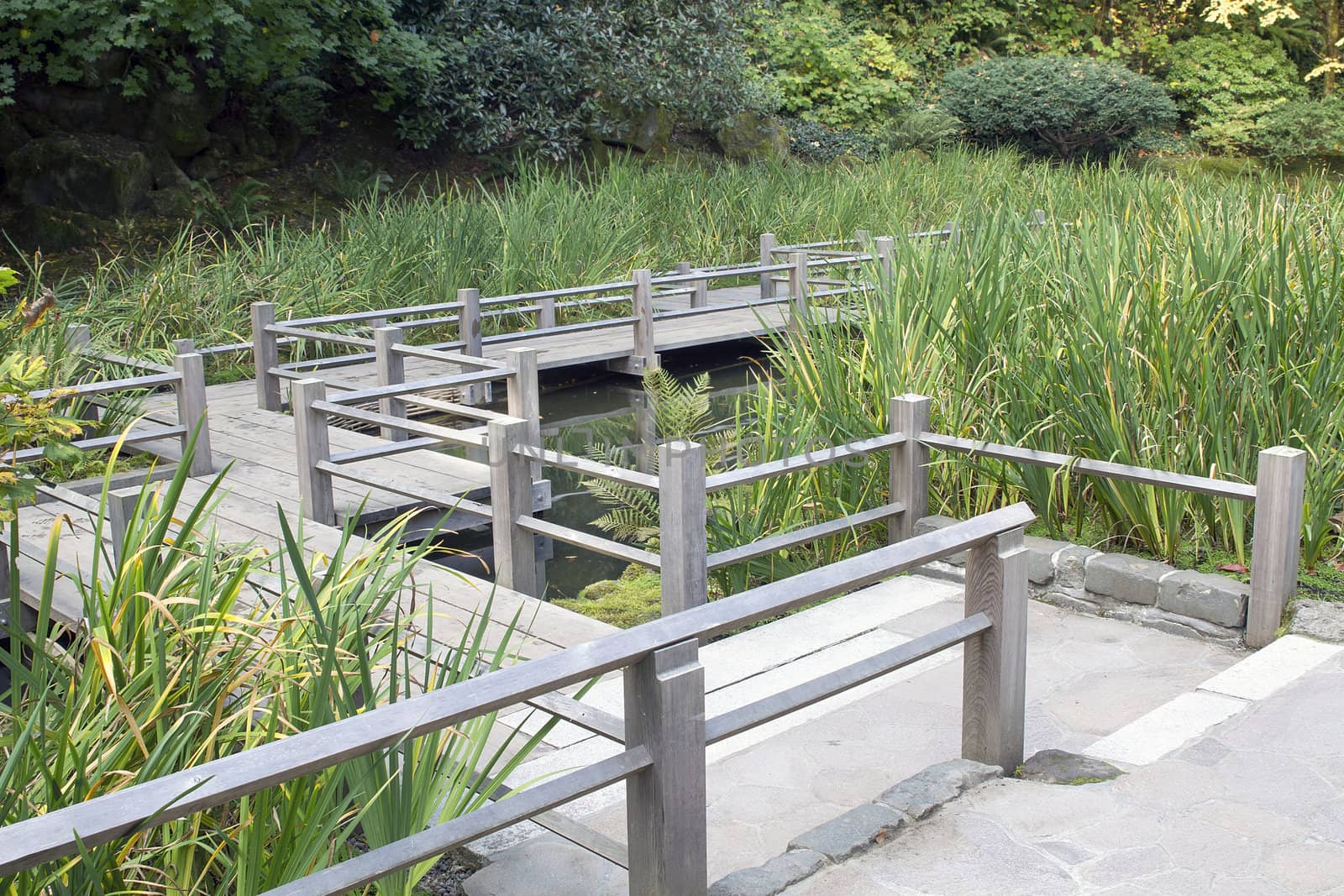 Japanese Garden Wooden Foot Bridge Over Pond