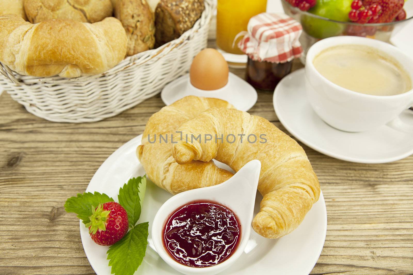 traditional french breakfast in morning on wooden background