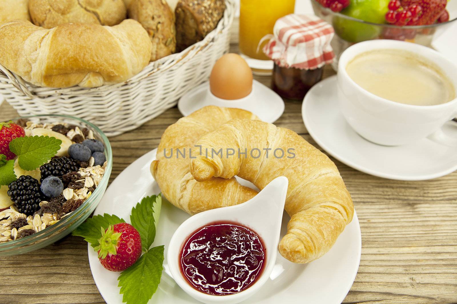 traditional french breakfast in morning on wooden background