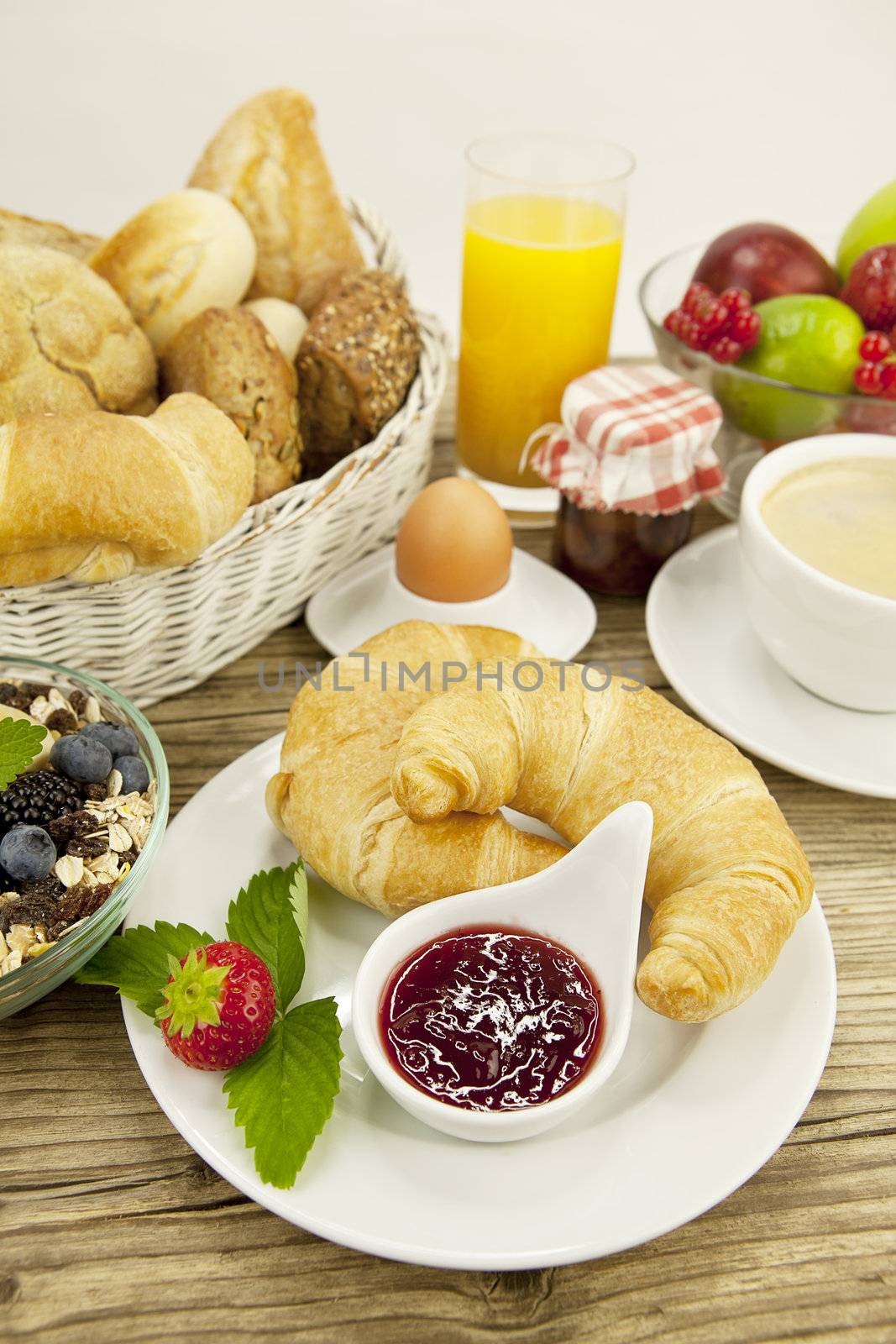 traditional french breakfast in morning on wooden background