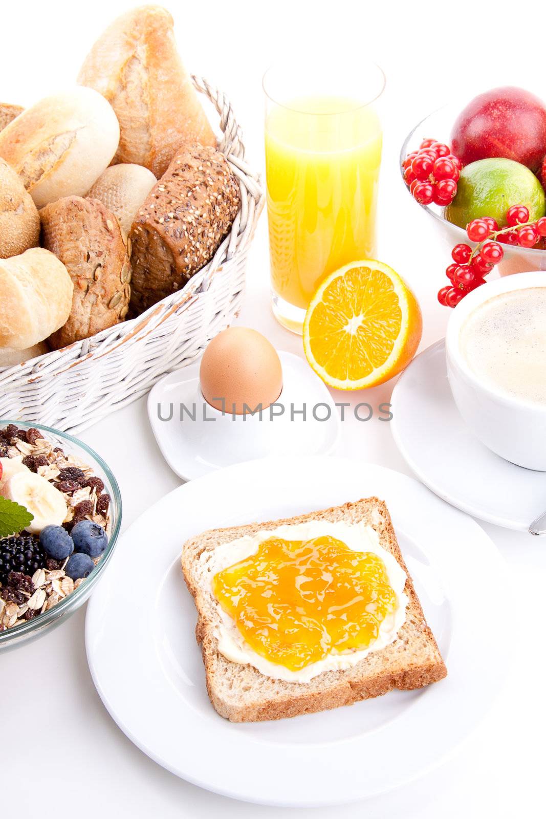 breakfast table with toast and orange marmelade isolated on white background