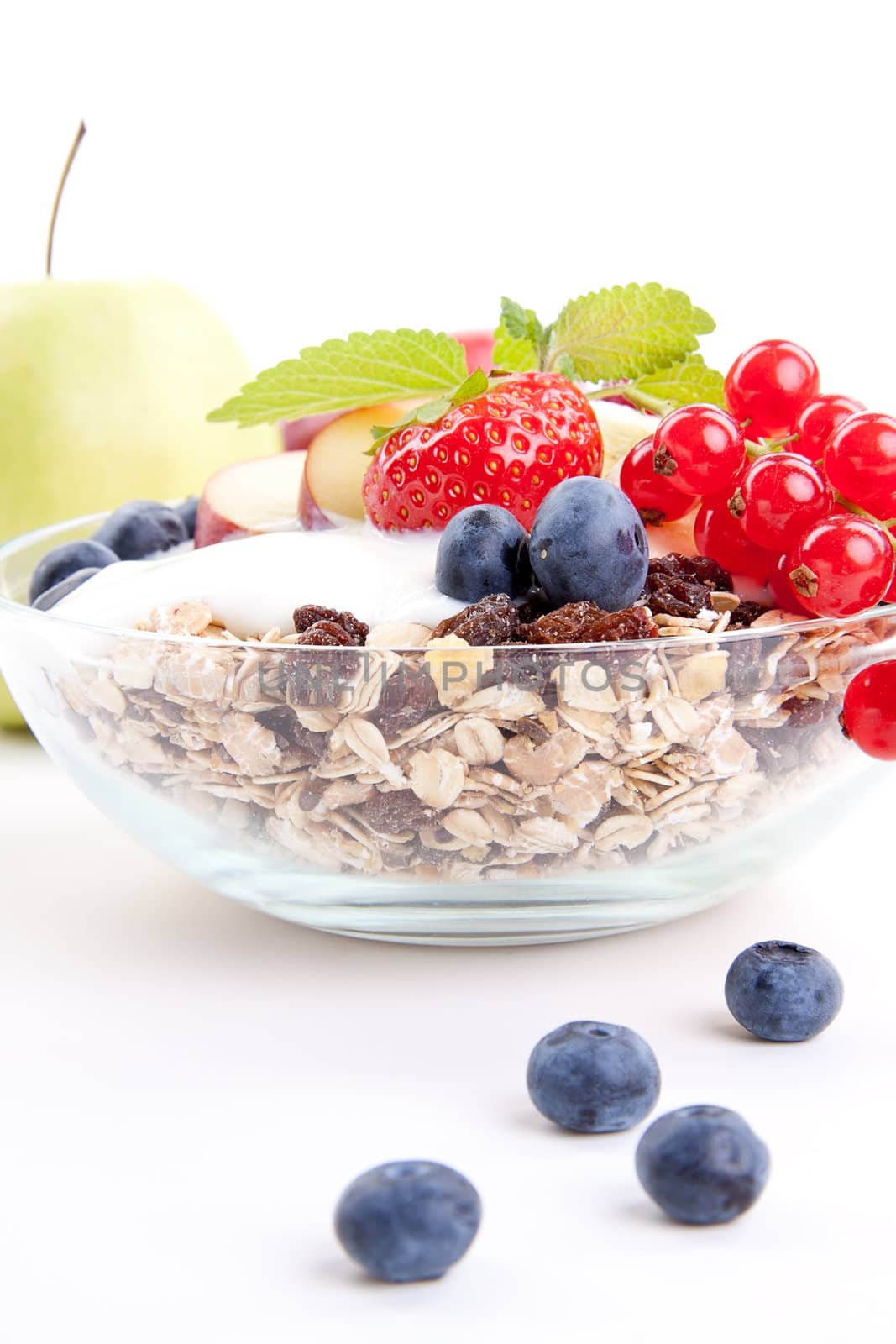deliscious healthy breakfast with flakes and fruits isolated on white background