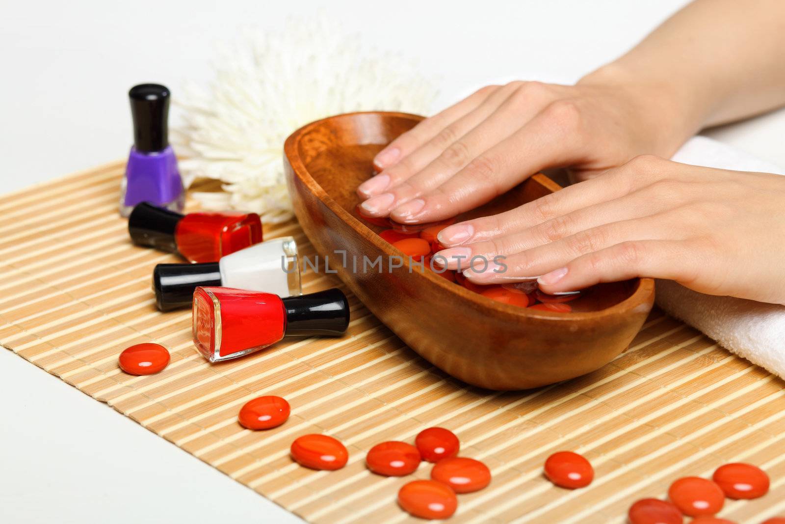 Young woman is getting manicure in a beauty salon