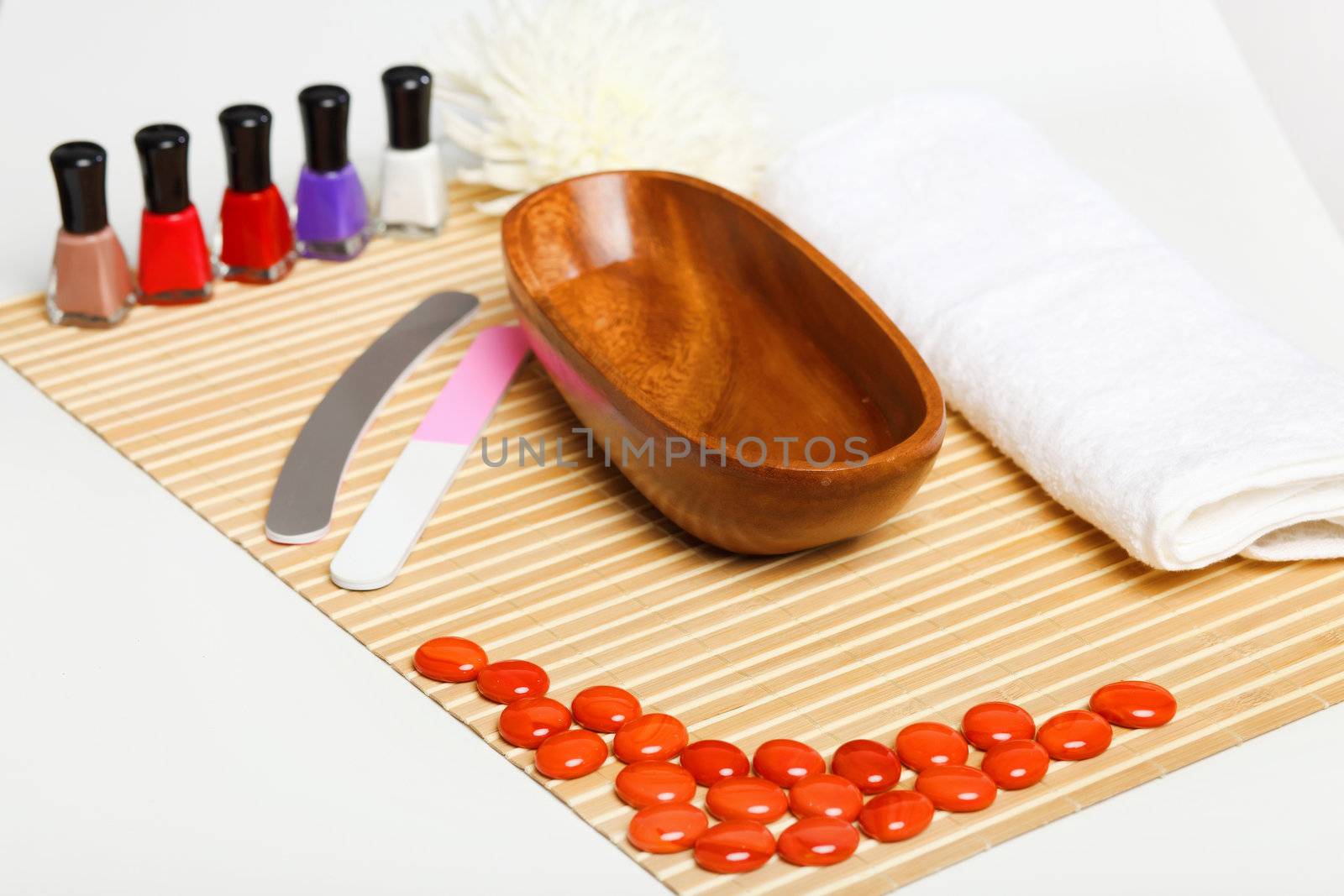 Young woman is getting manicure in a beauty salon