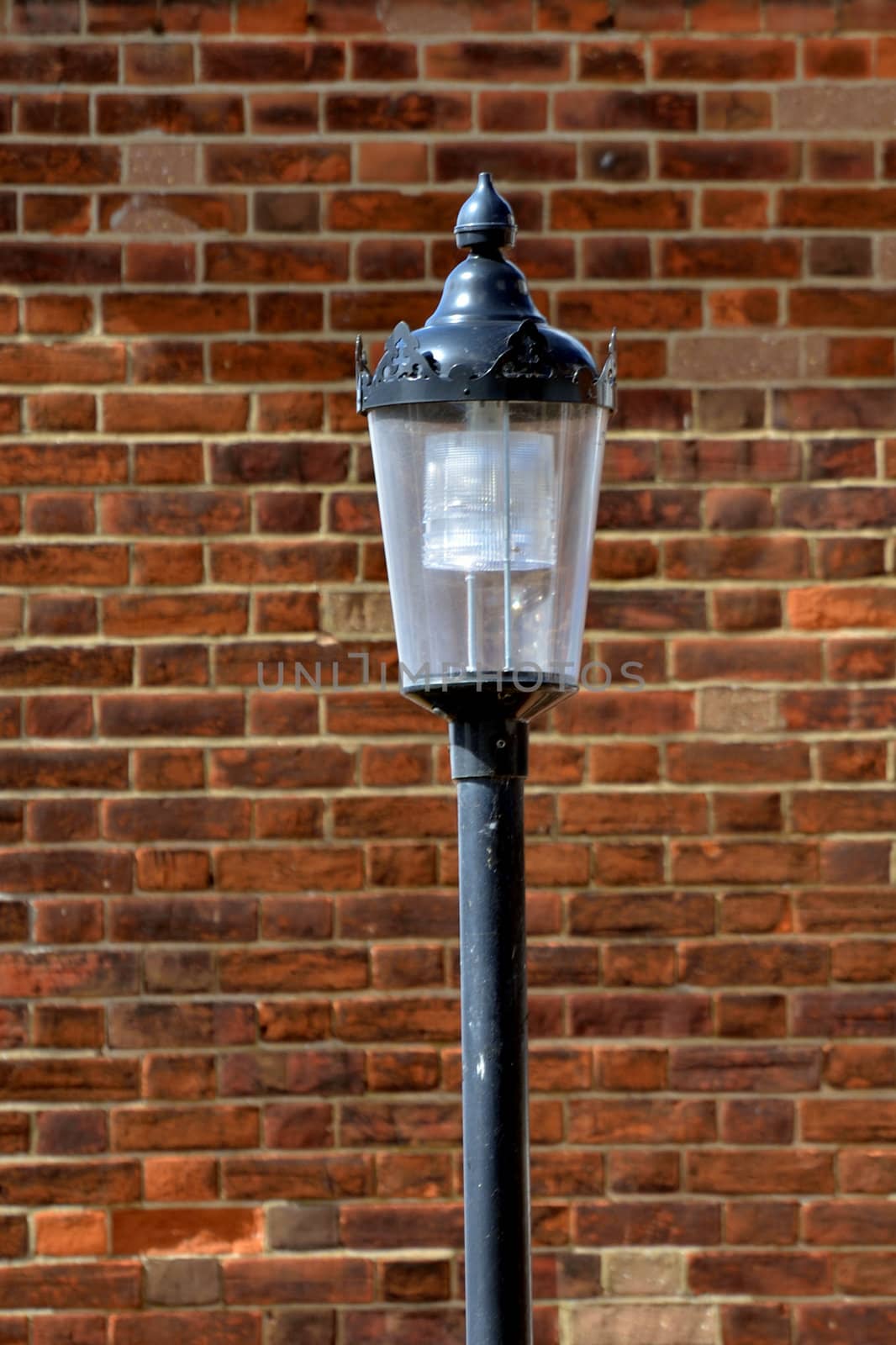 Black Lamp with Brick Background by pauws99