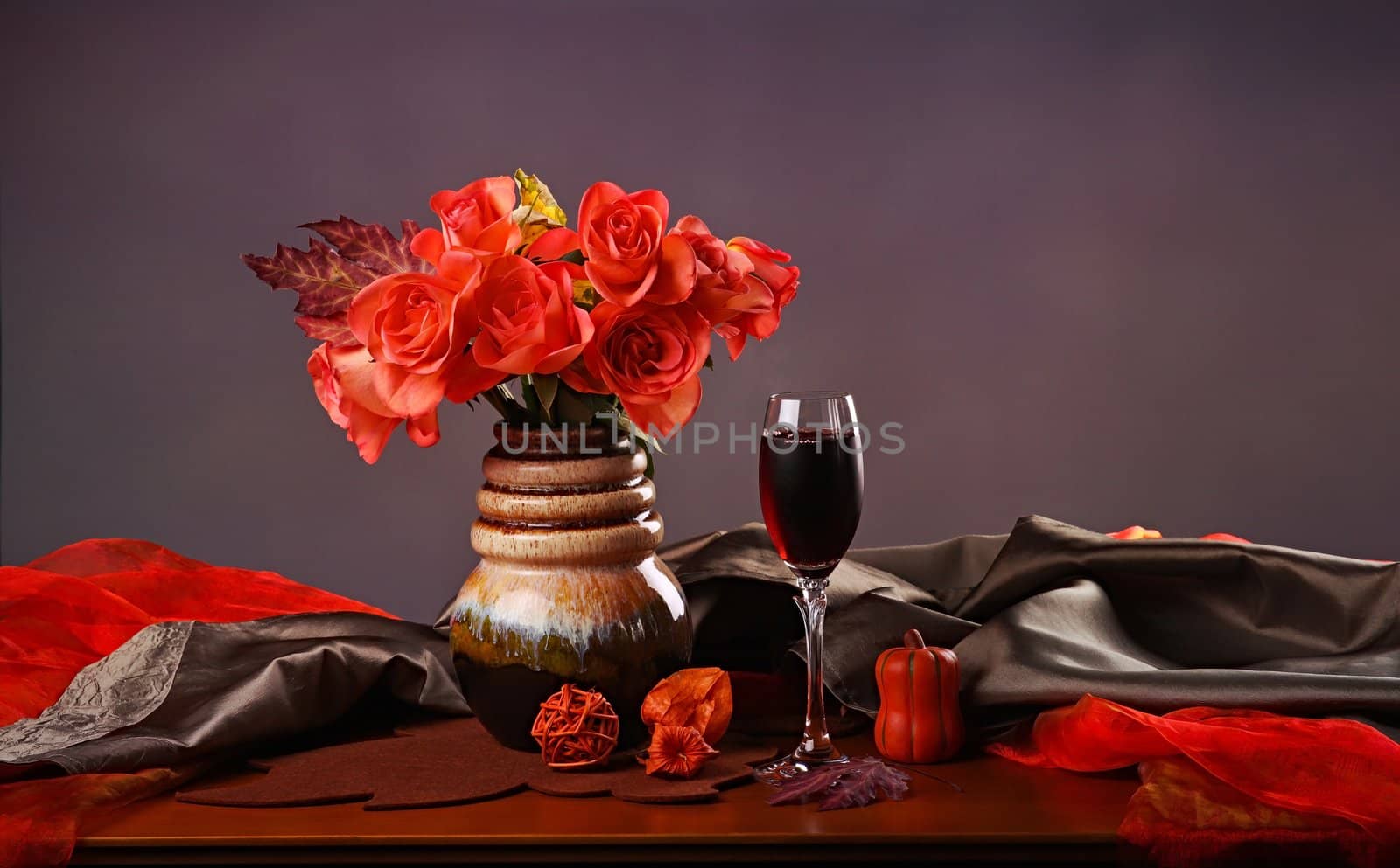 Still life with red wine and roses