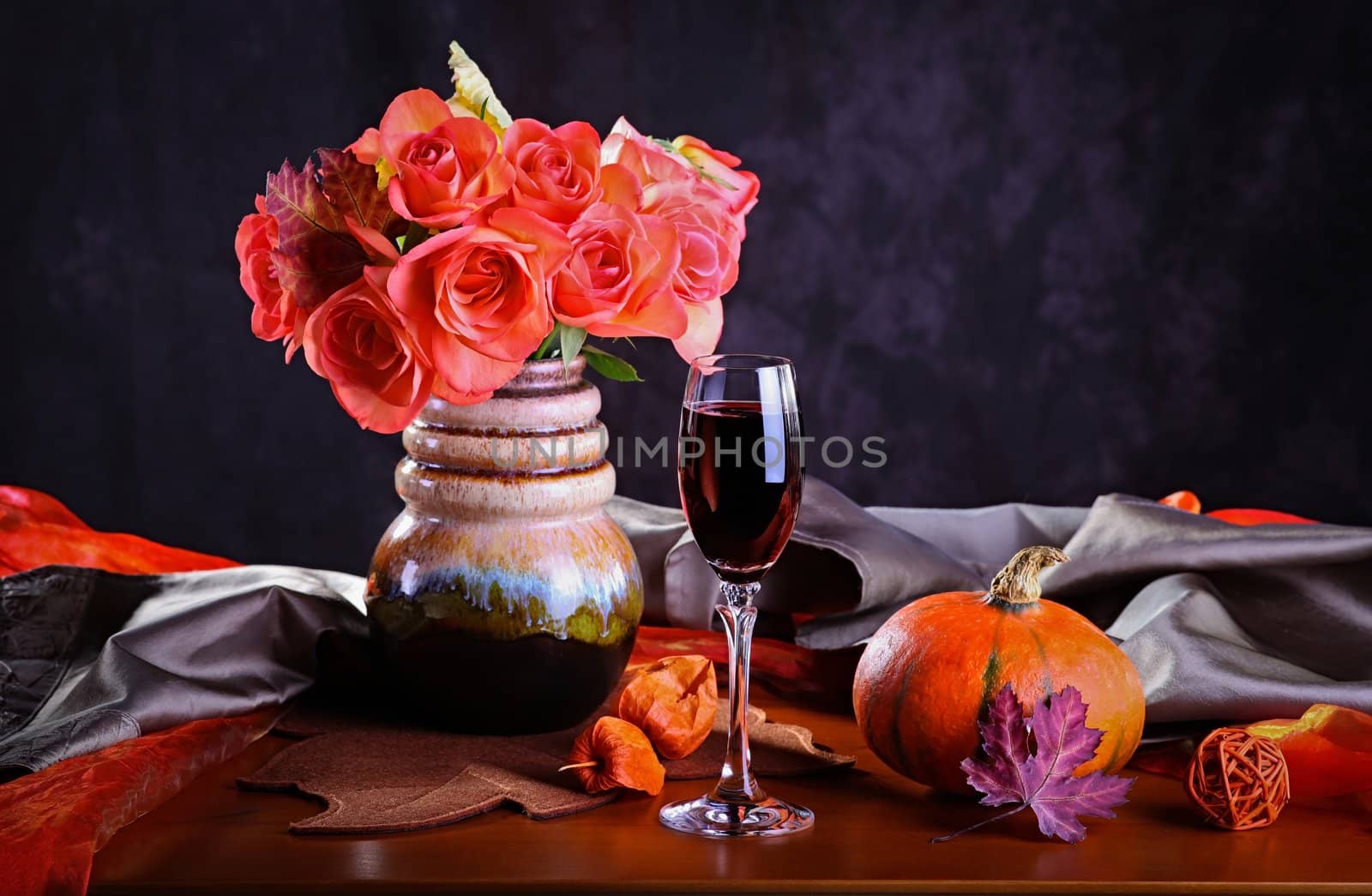 Still life with red wine and roses