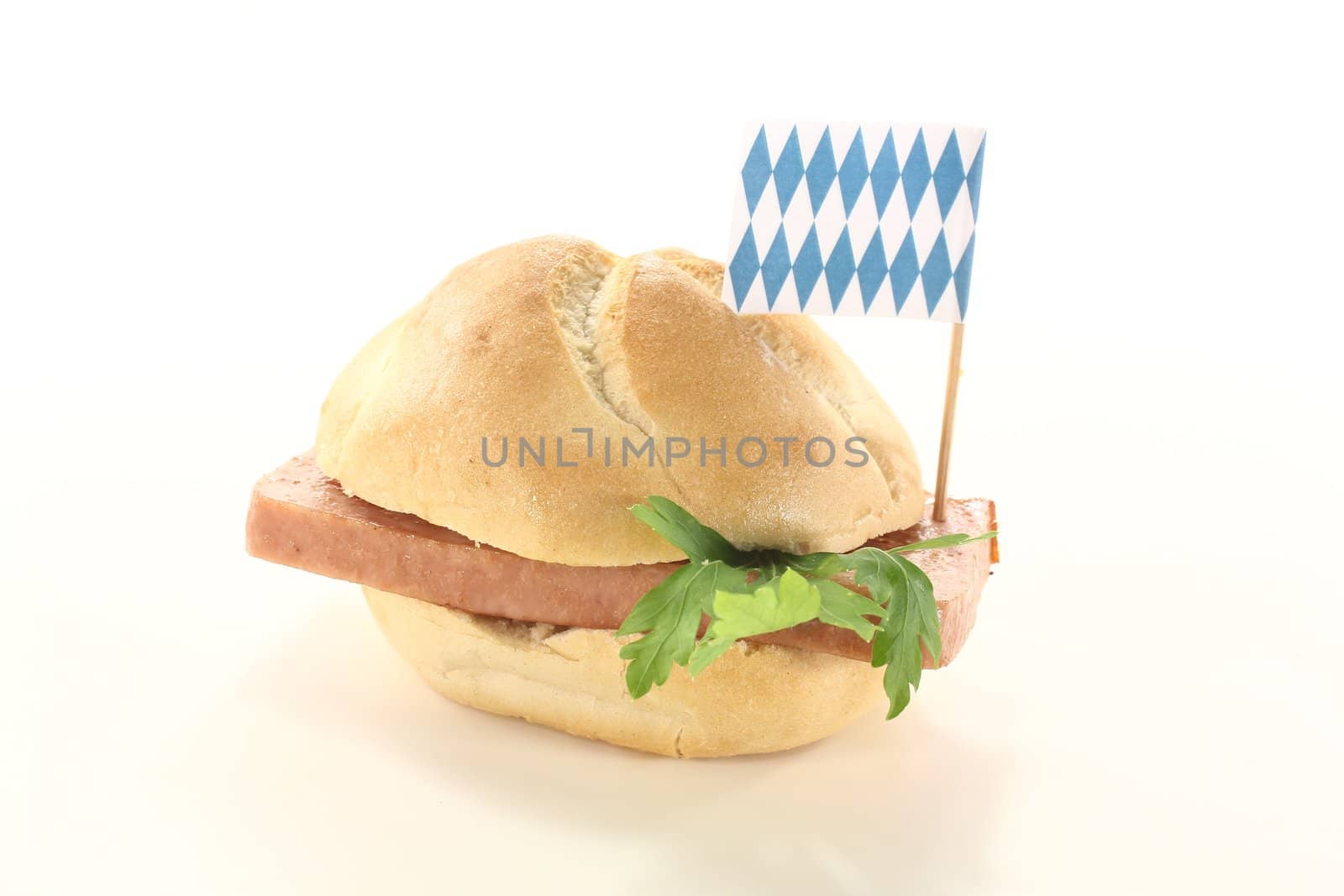 fresh beef and pork loaf with parsley on a light background