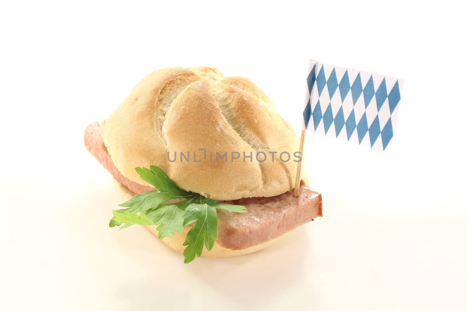 fresh Bavarian beef and pork loaf with parsley on a light background