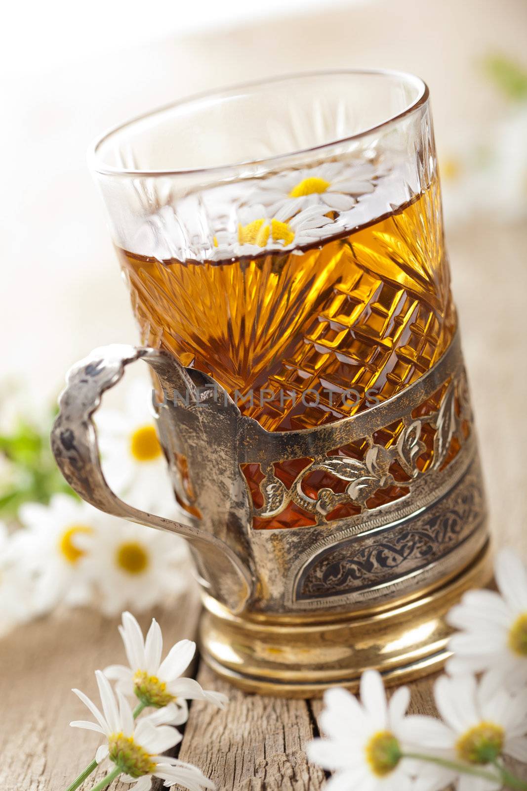 cup of herbal tea with chamomile flowers 