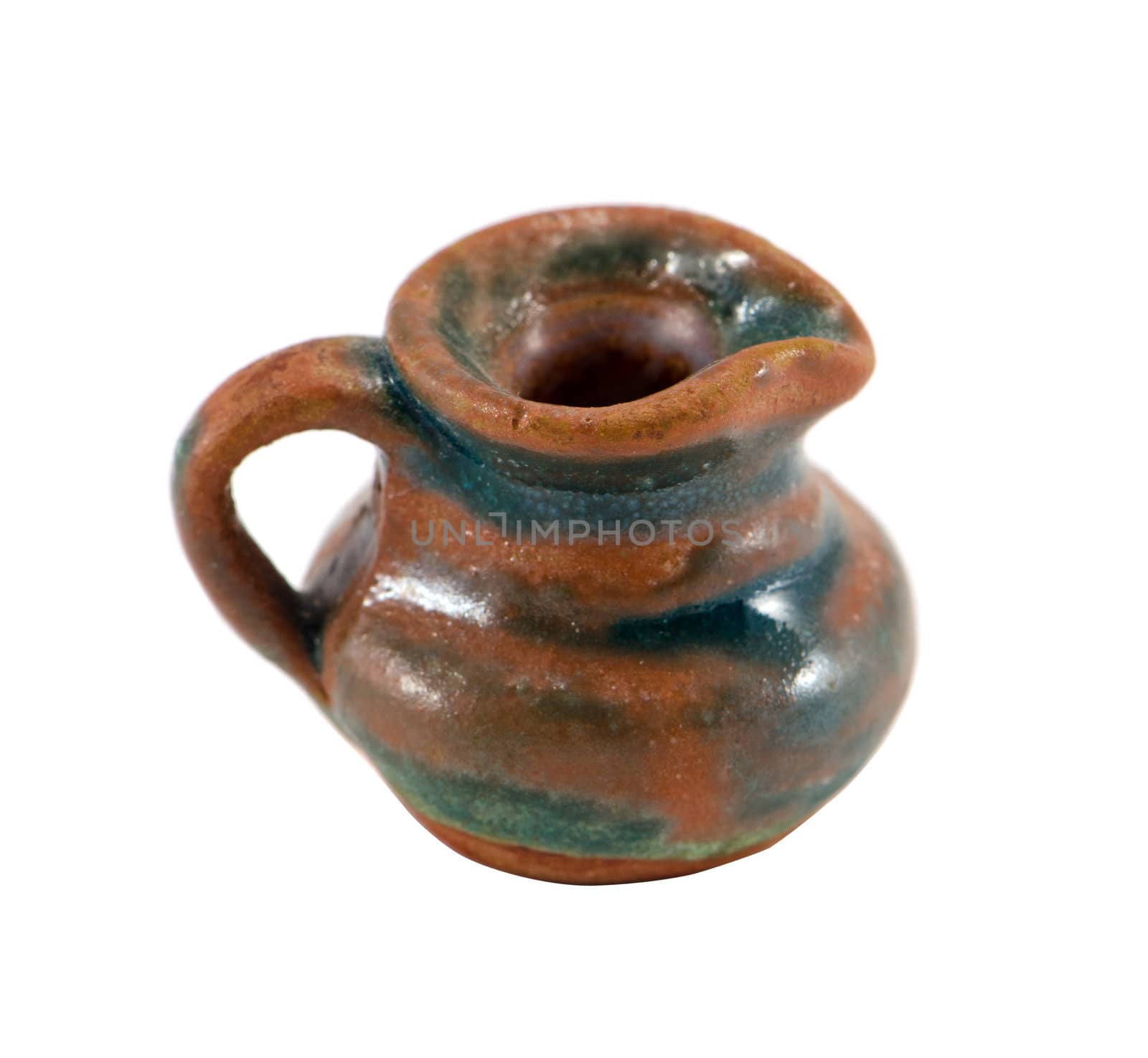 Vintage clay pitcher brown green color small object with handle isolated on white background. Home handmade decoration.