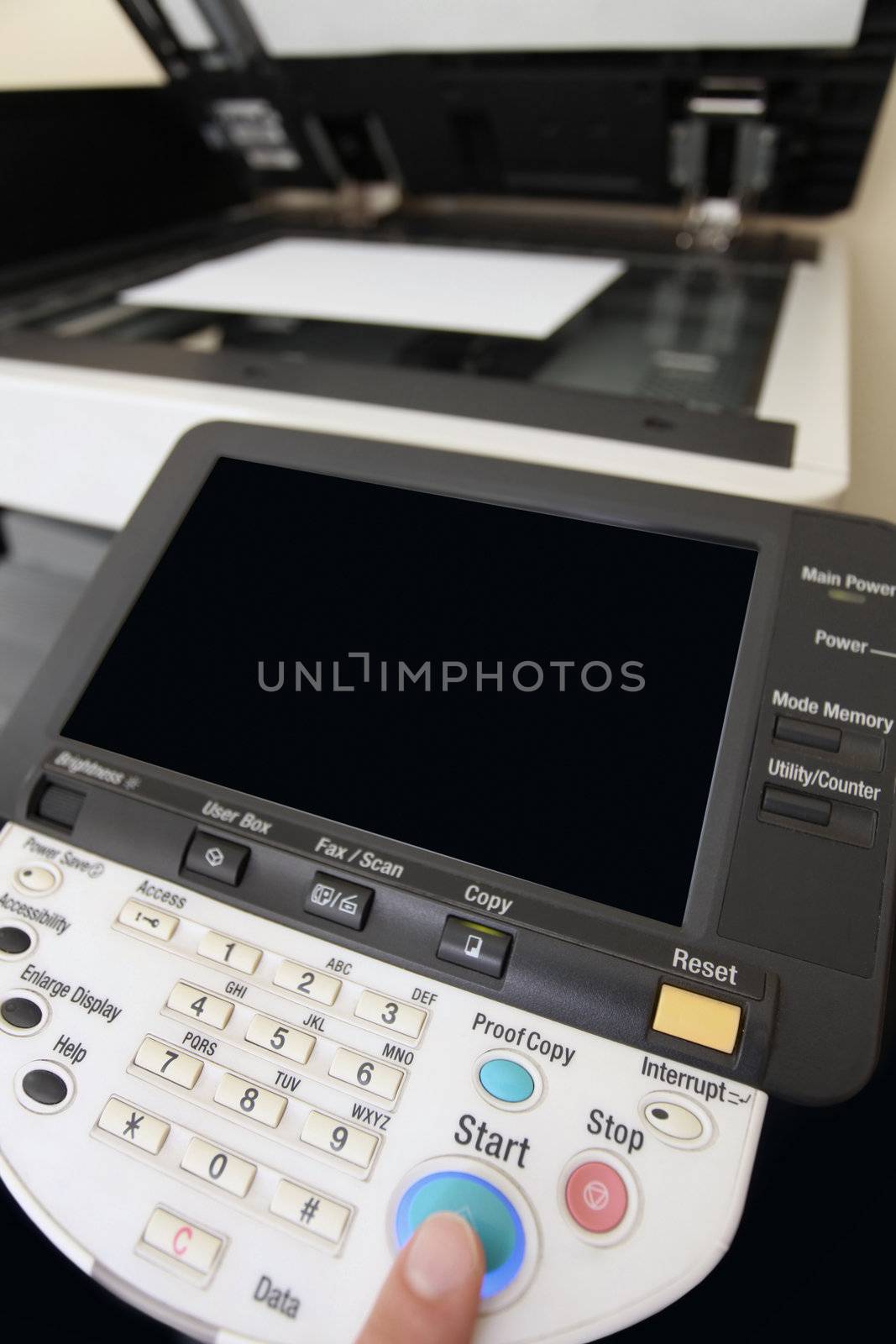 details Finger pressing of keyboard buttons of the laser copier