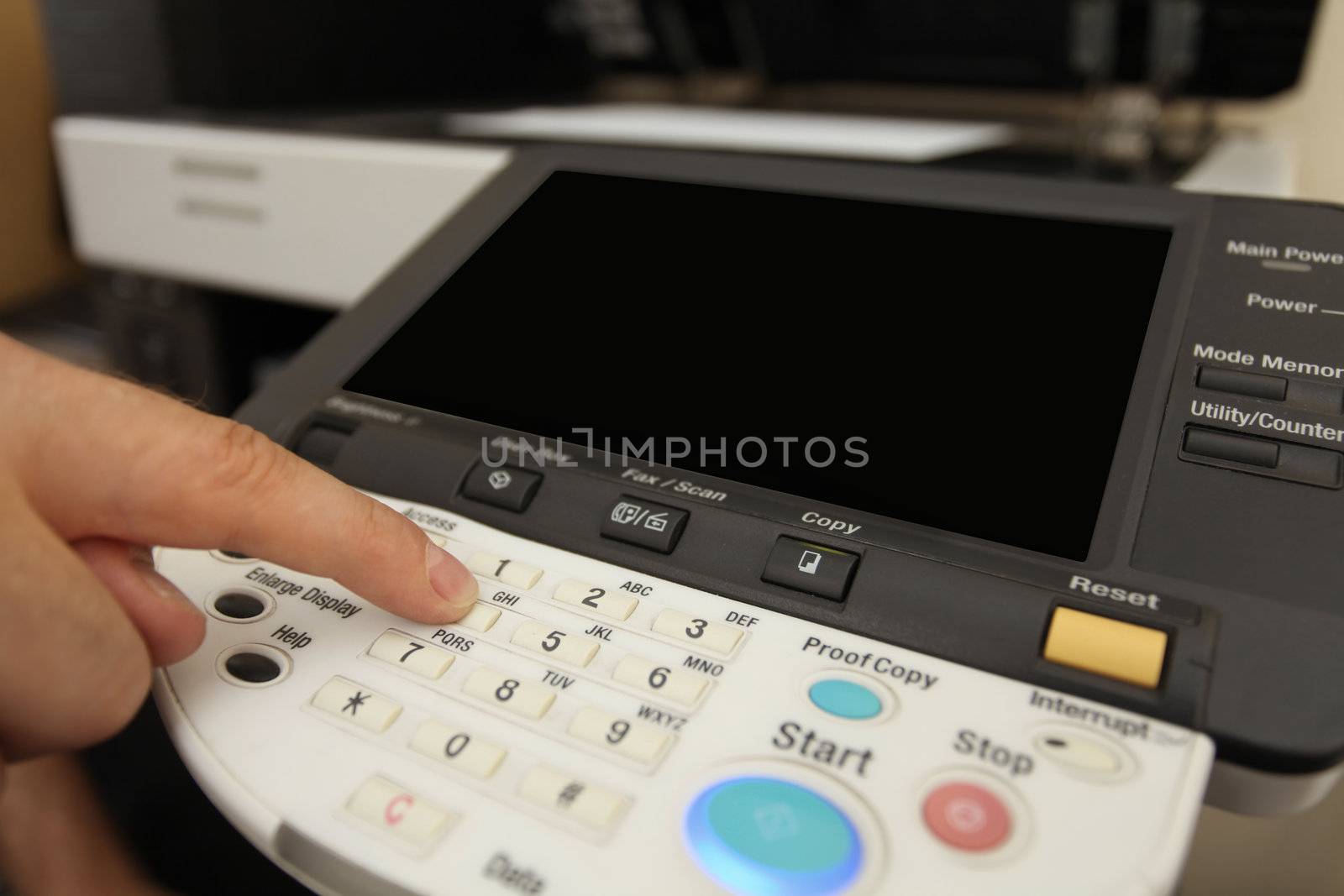 details Finger pressing of keyboard buttons of the laser copier