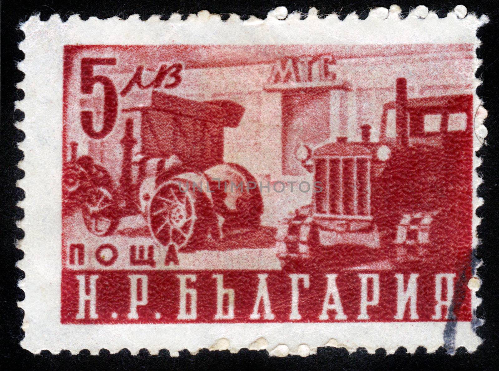 BULGARIA - CIRCA 1951: A stamp printed in Bulgaria shows first bulgarian tractor, circa 1951