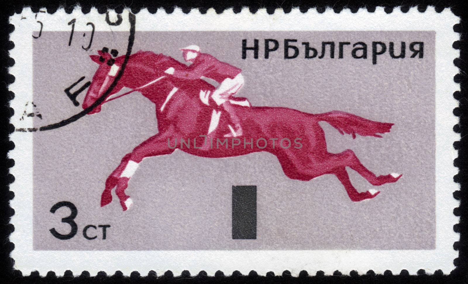 BULGARIA - CIRCA 1965: stamp printed in Bulgaria, shows equestrian sport,  jumping, circa 1965