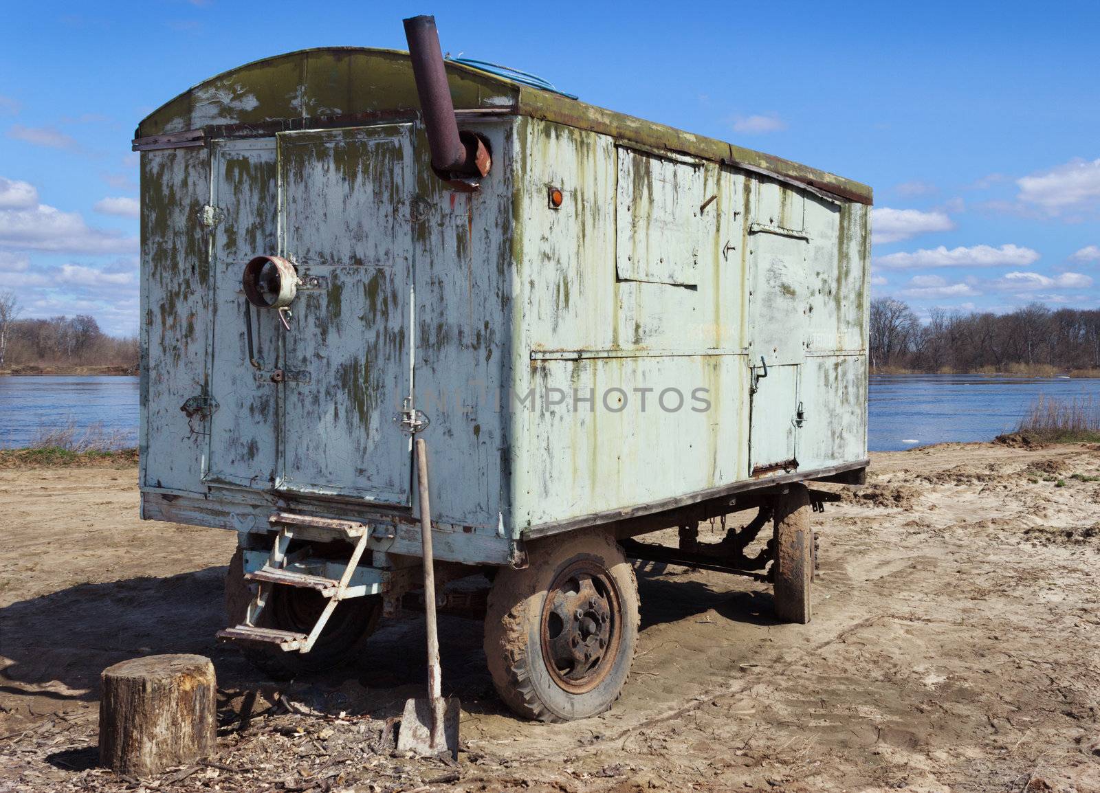 Old car trailer kung in a vacant lot