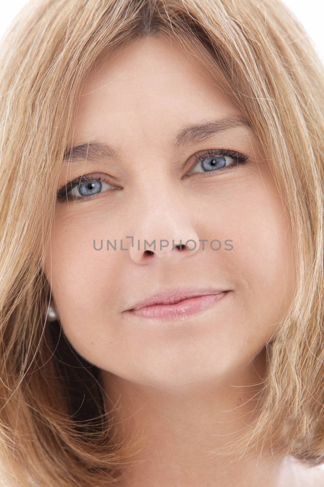 Closeup headshot portrait of an attractive mature woman with beautiful skin and shoulder length blond hair