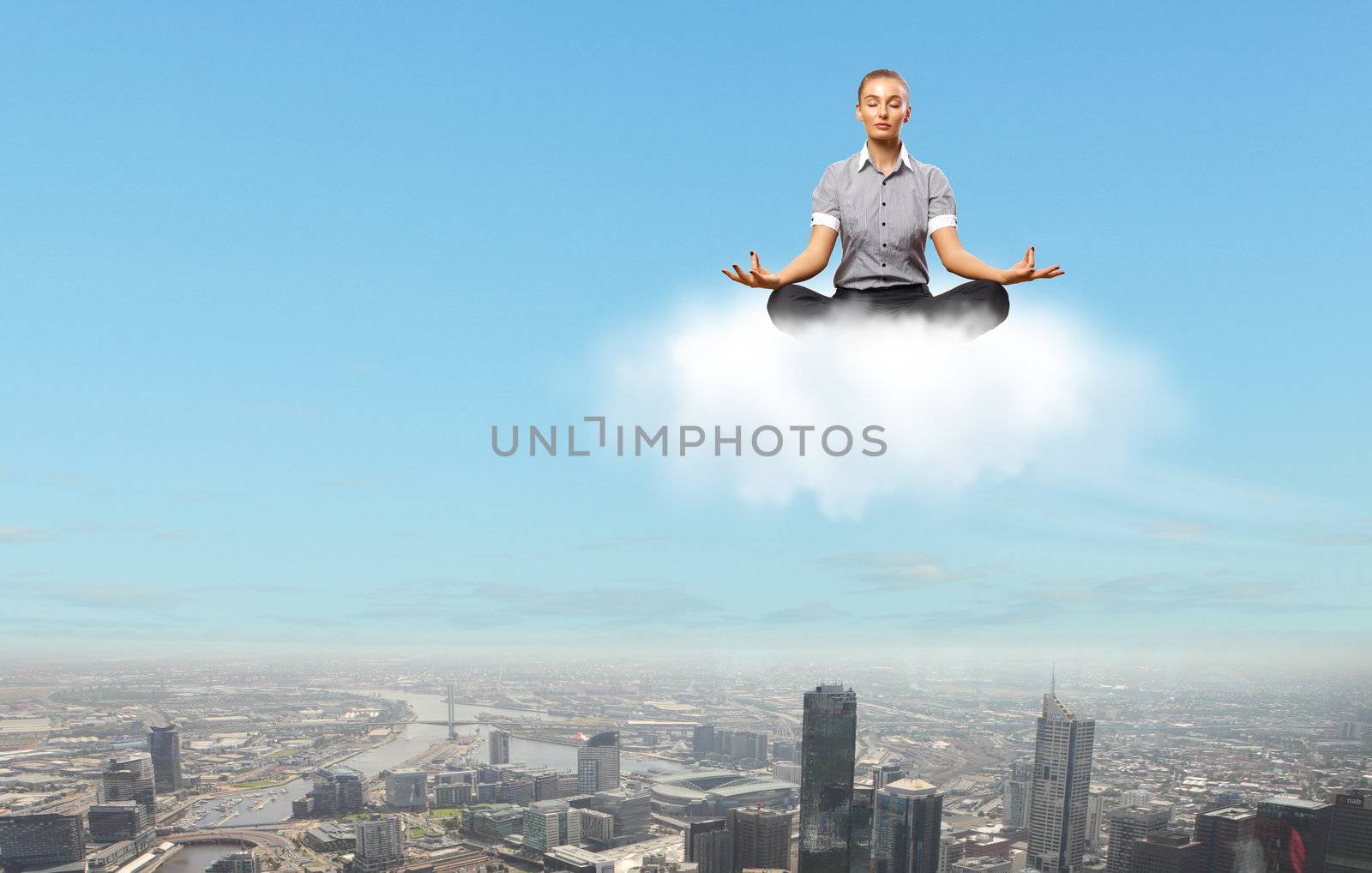 Businesswoman meditating sitting on the cloud by sergey_nivens
