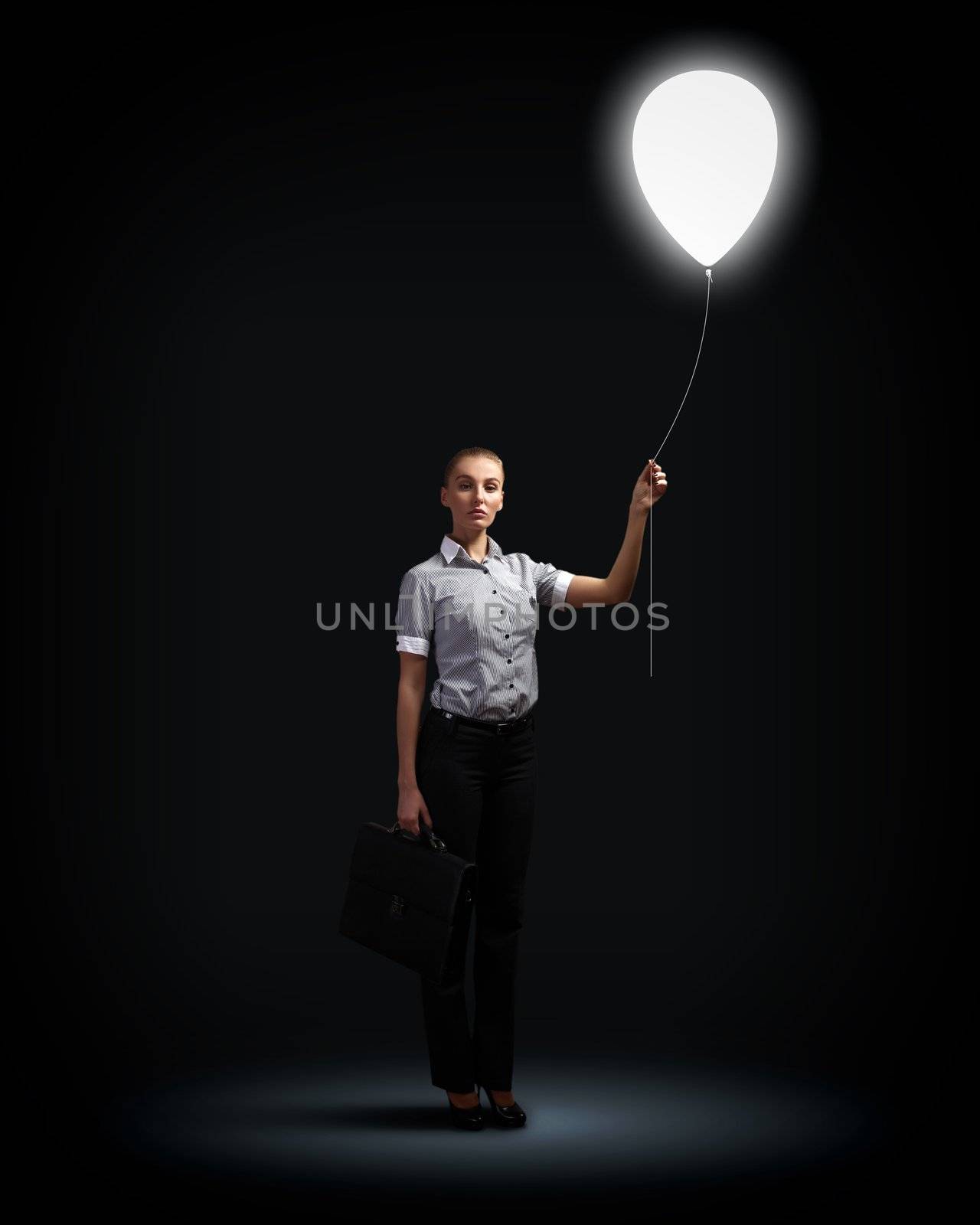 Light bulb and a business person as symbols of creativity in business