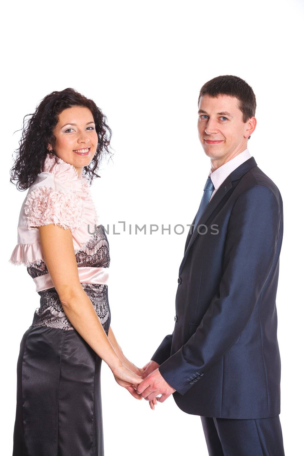 Sweet happy young couple smiling together. Isolated on white background