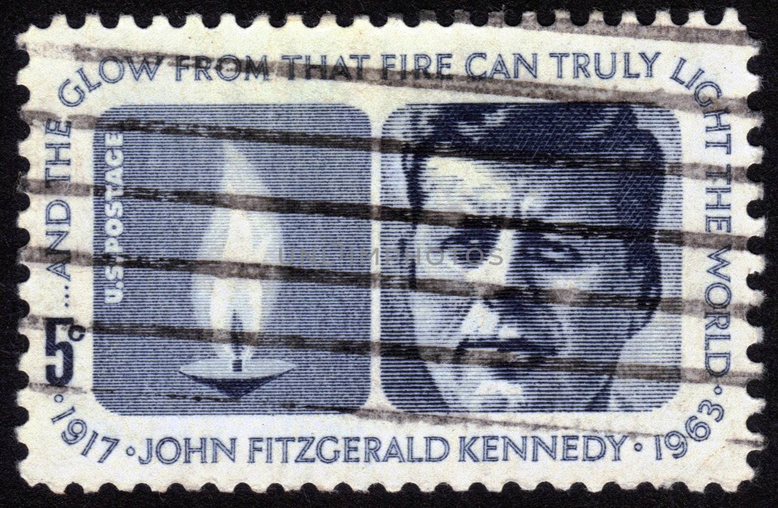 UNITED STATES OF AMERICA - CIRCA 1964: a stamp printed in the United States of America shows President  John Fitzgerald Kennedy (1917-1963) and Eternal Flame, circa 1964