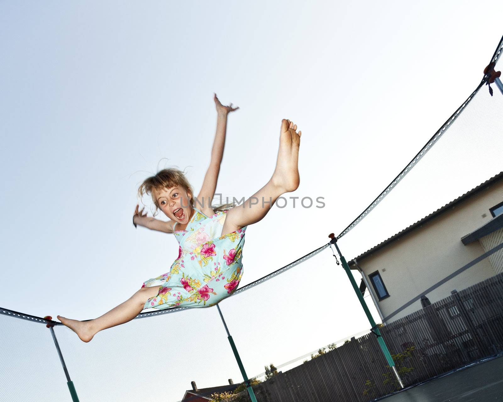 Young Girl Jumping in a trampoline