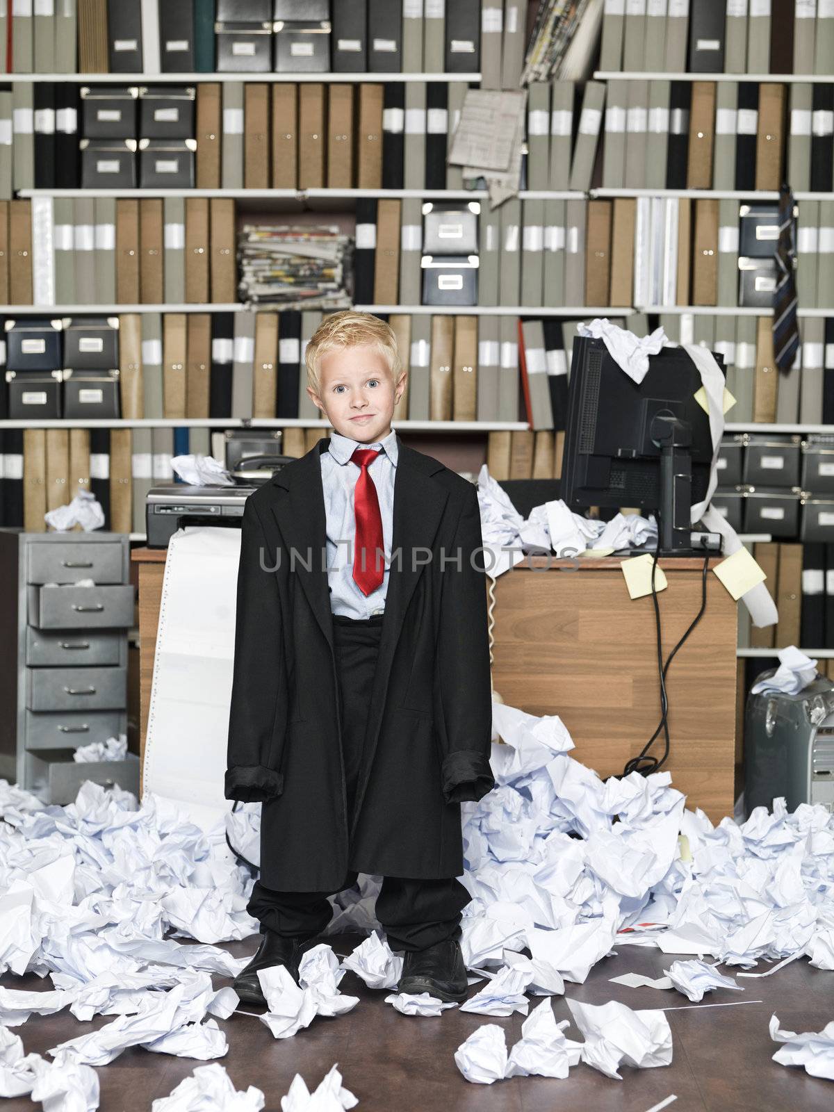 Young Businessman wearing oversized clothes in messy office