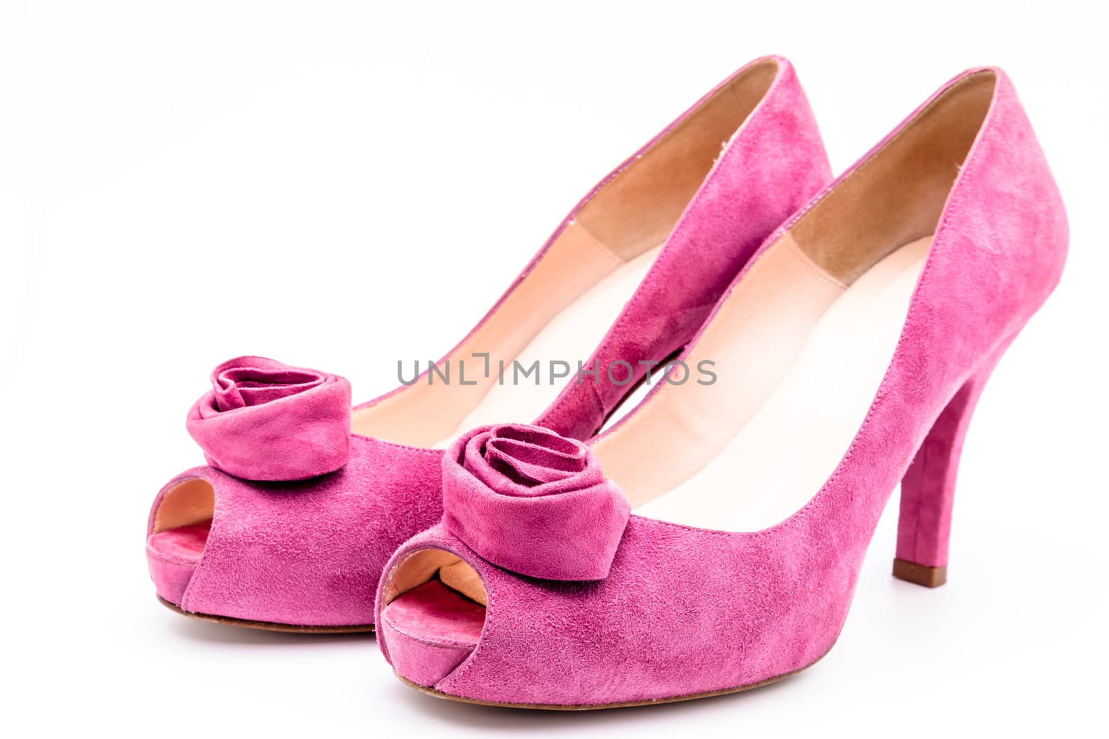 Pair of pink  dress women shoes isolated over white