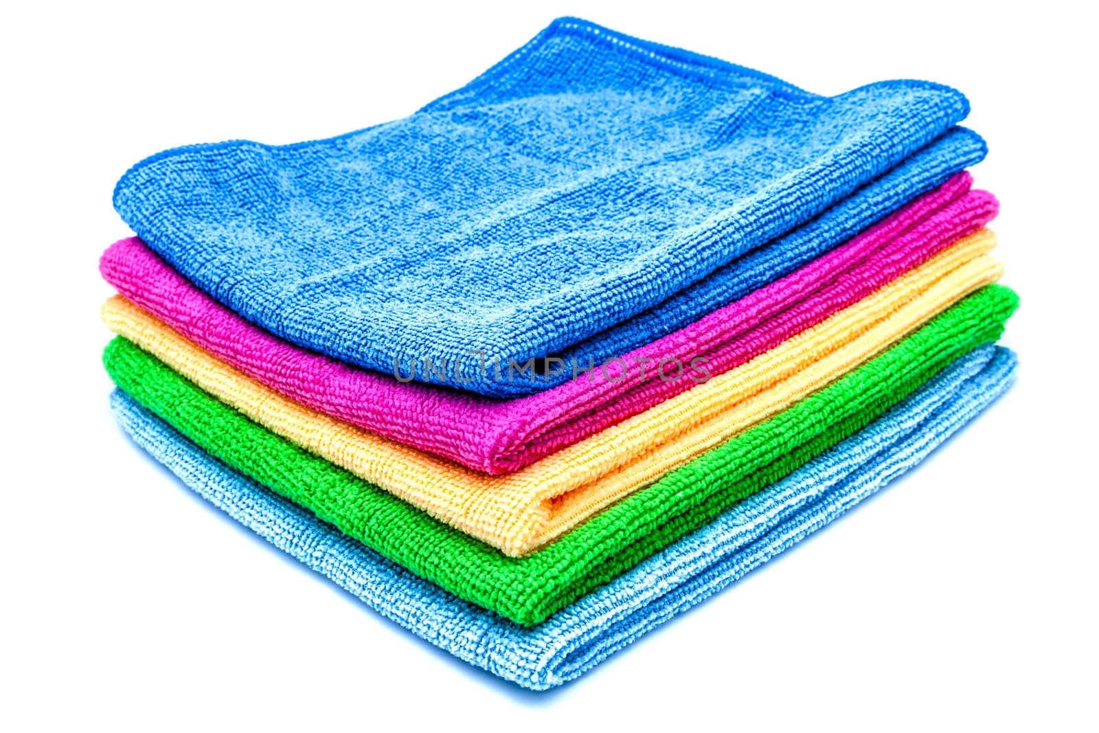 Stacked colorful towels on a white background