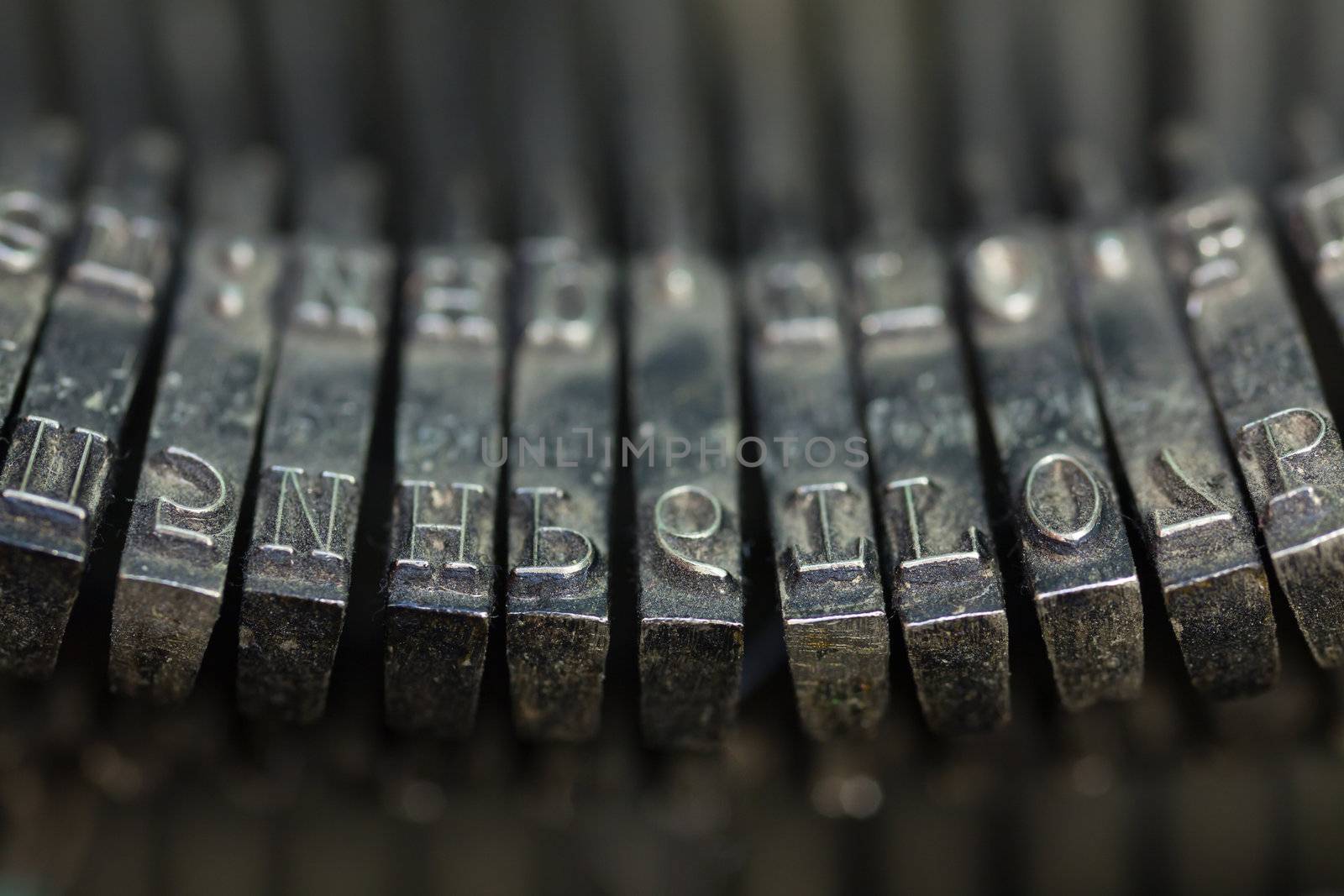 Close up of worn a little rusty and dusty antique typewriter keys.