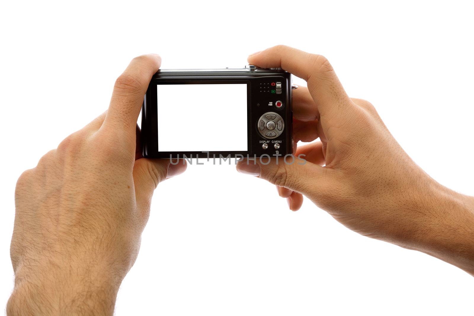 Hands of a man holding a digital camera on a white background