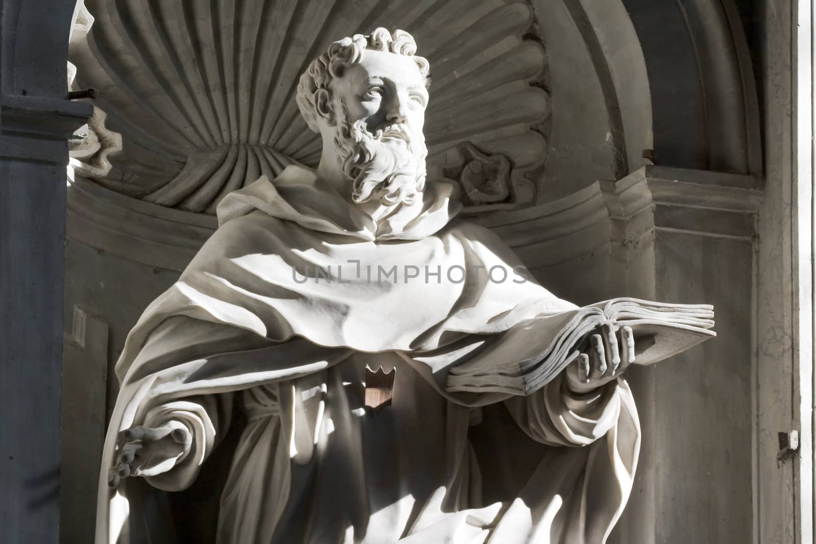 Sculpture in a niche on the wall inside St. Peter's Basilica in Rome, Italy