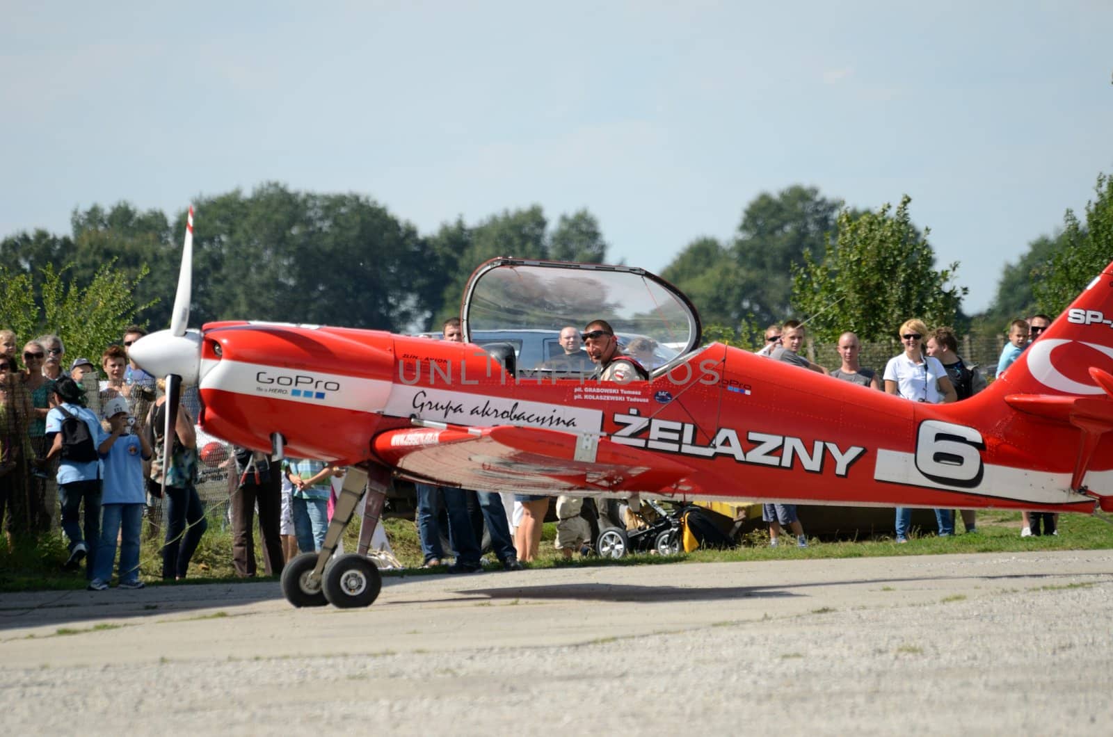 SZYMANOW, POLAND - AUGUST 25: Pilot Tadeusz Kolaszewski lands after the acrobatic show in plane Zlin-50 LS on August 25, 2012 in Szymanow.