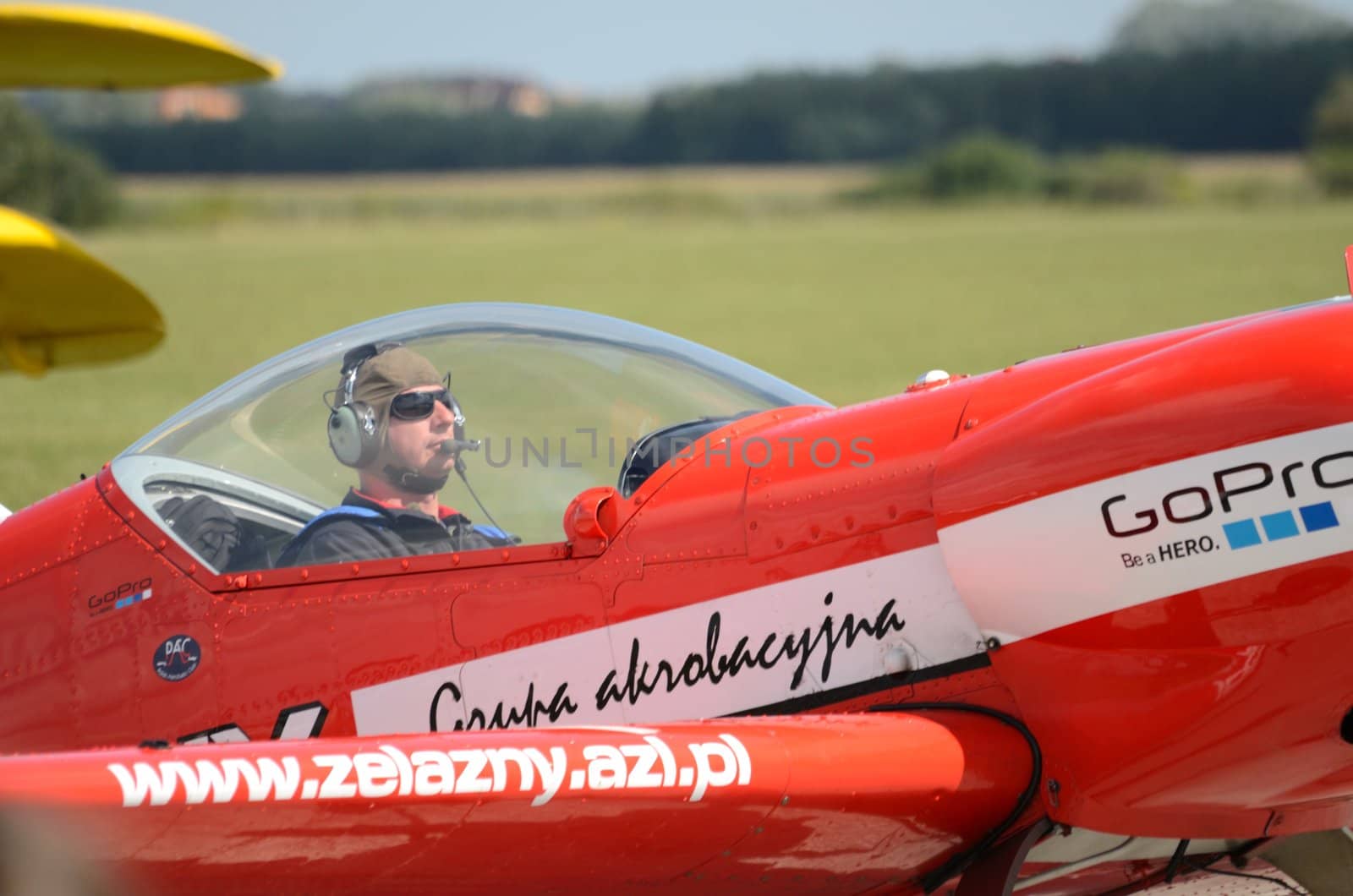 SZYMANOW, POLAND - AUGUST 25: Pilot Piotr Haberland arrives back after acrobatic show in plane Zlin-50 LS on August 25, 2012 in Szymanow.