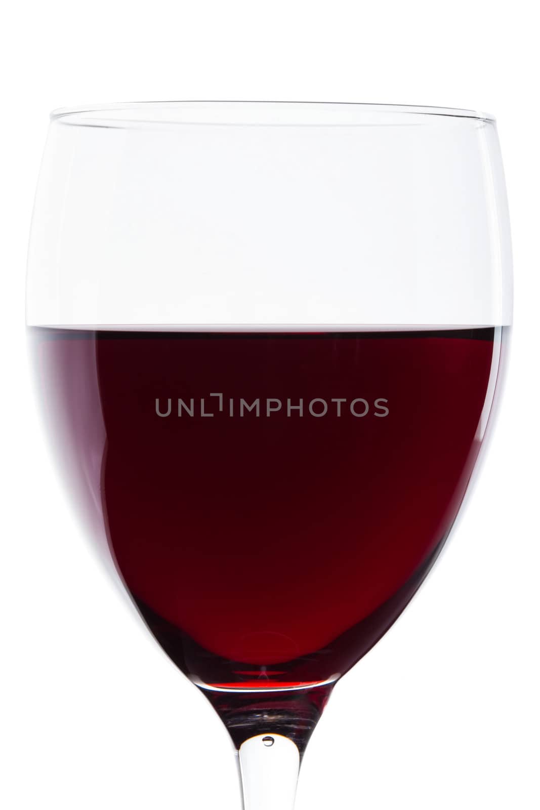 Macro shooting with a glass of red wine on a white background