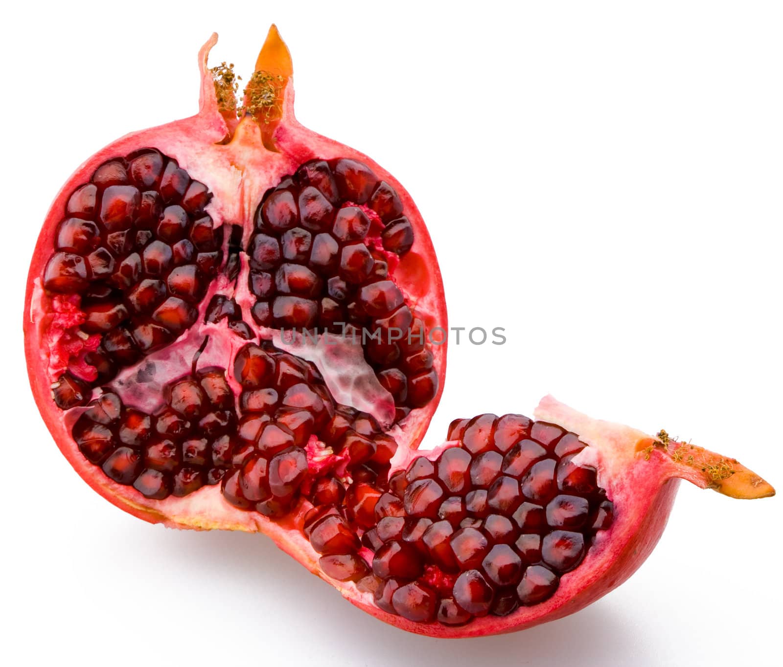 Juicy sliced pomegranate on a white background