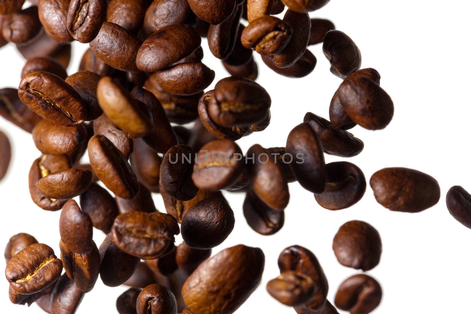 Falling coffee beans on white background by Antartis