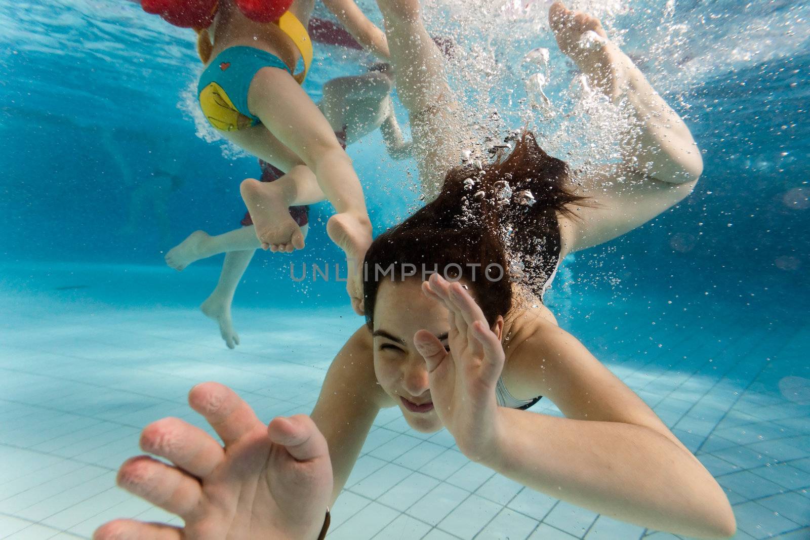 Children swim in the water park and have fun in the water