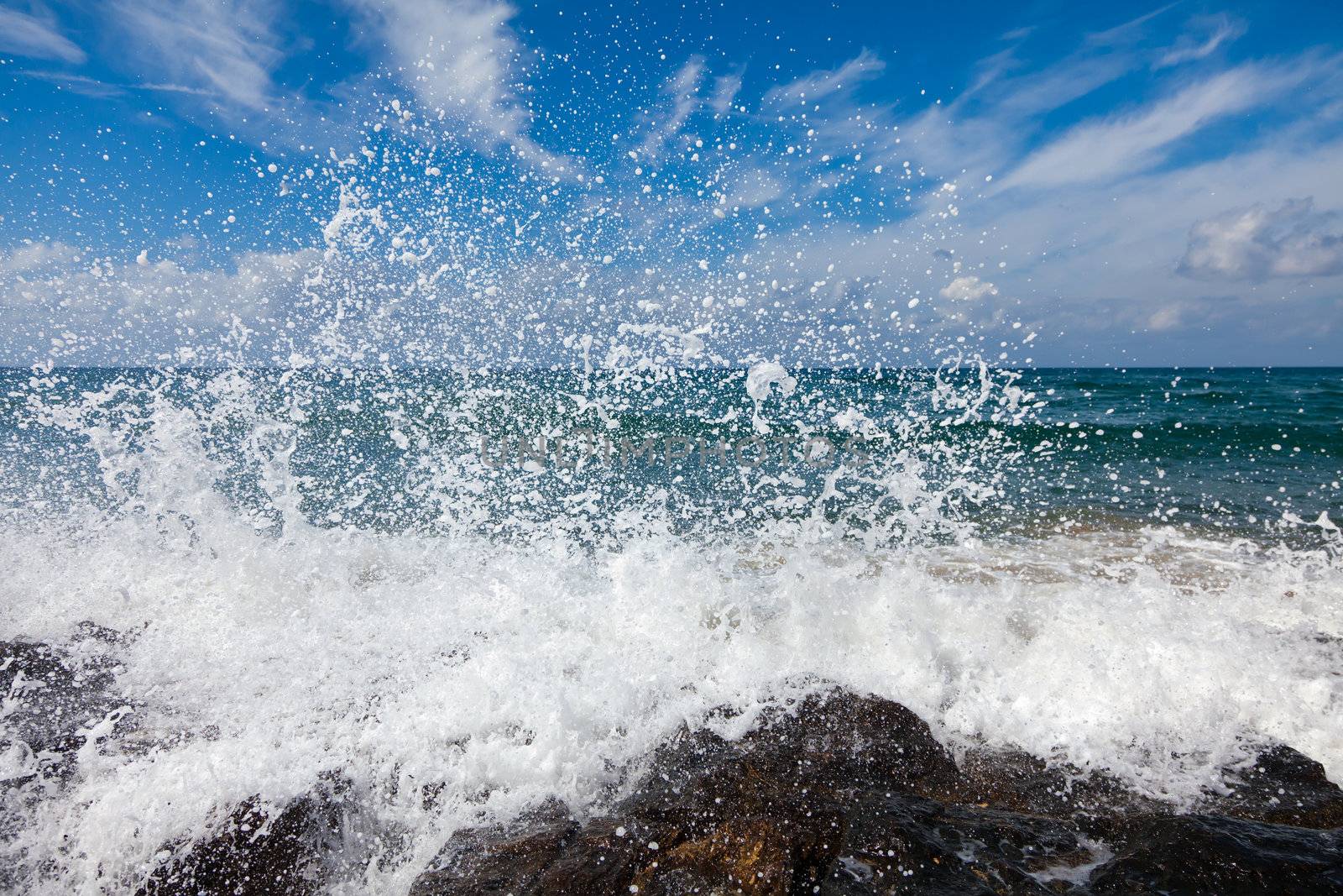 The waves breaking on a stony beach by Antartis