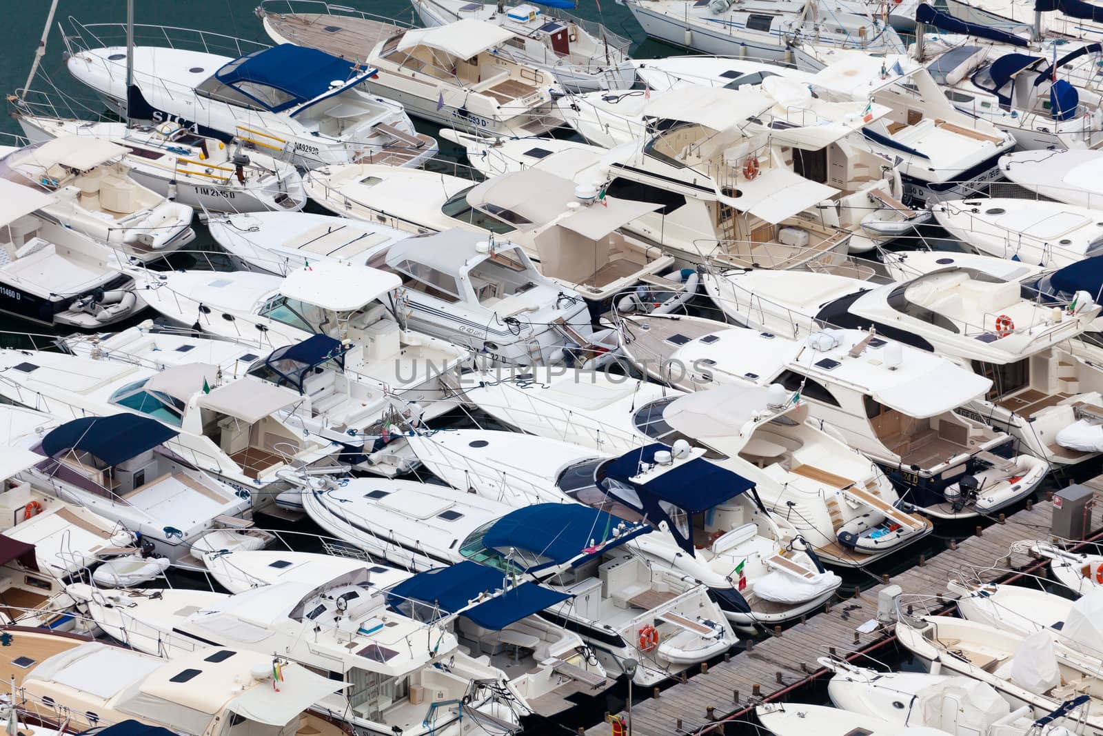 Large parking boats at sea in a small seaside town by Antartis