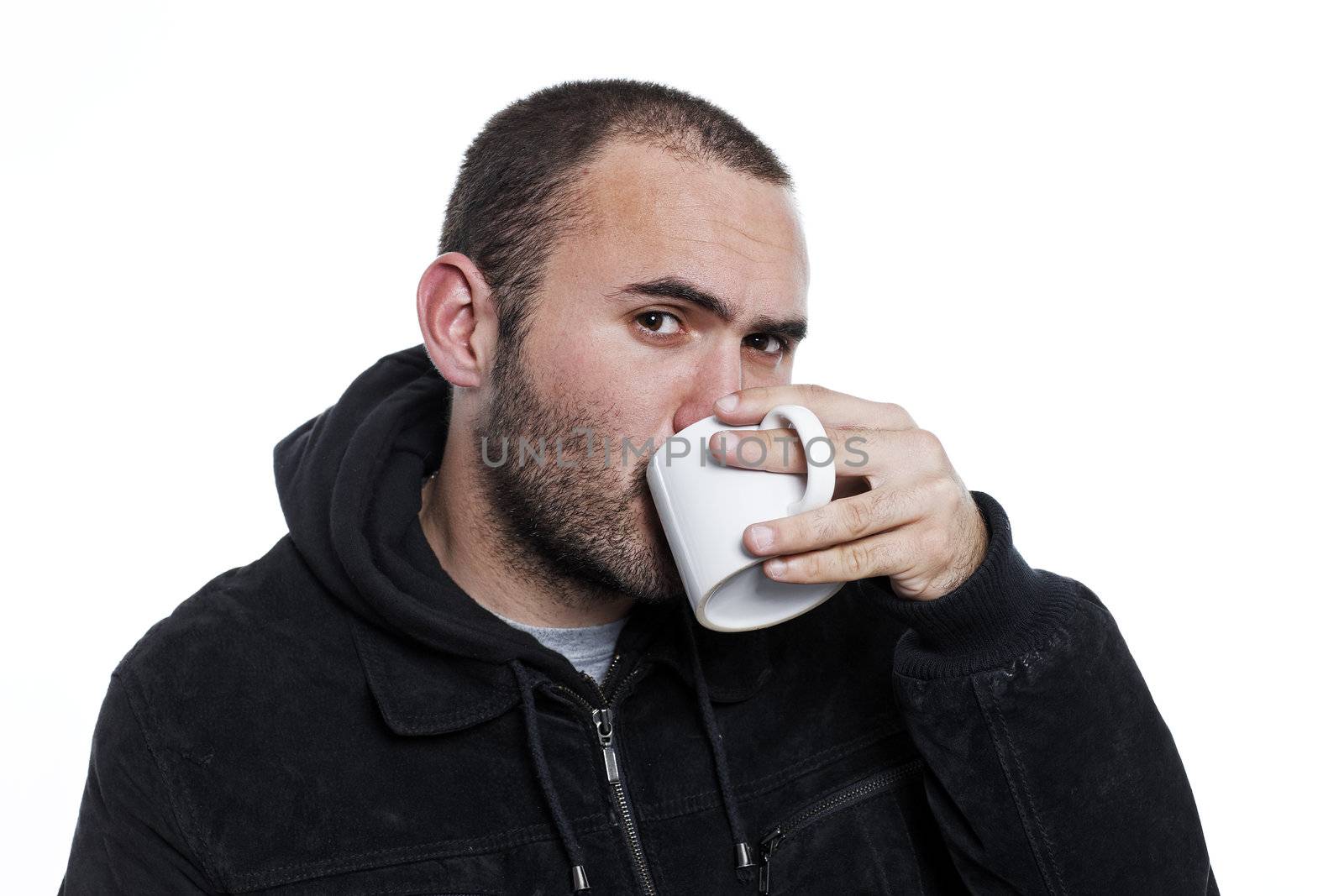 black dressed man drinking tea in a cup