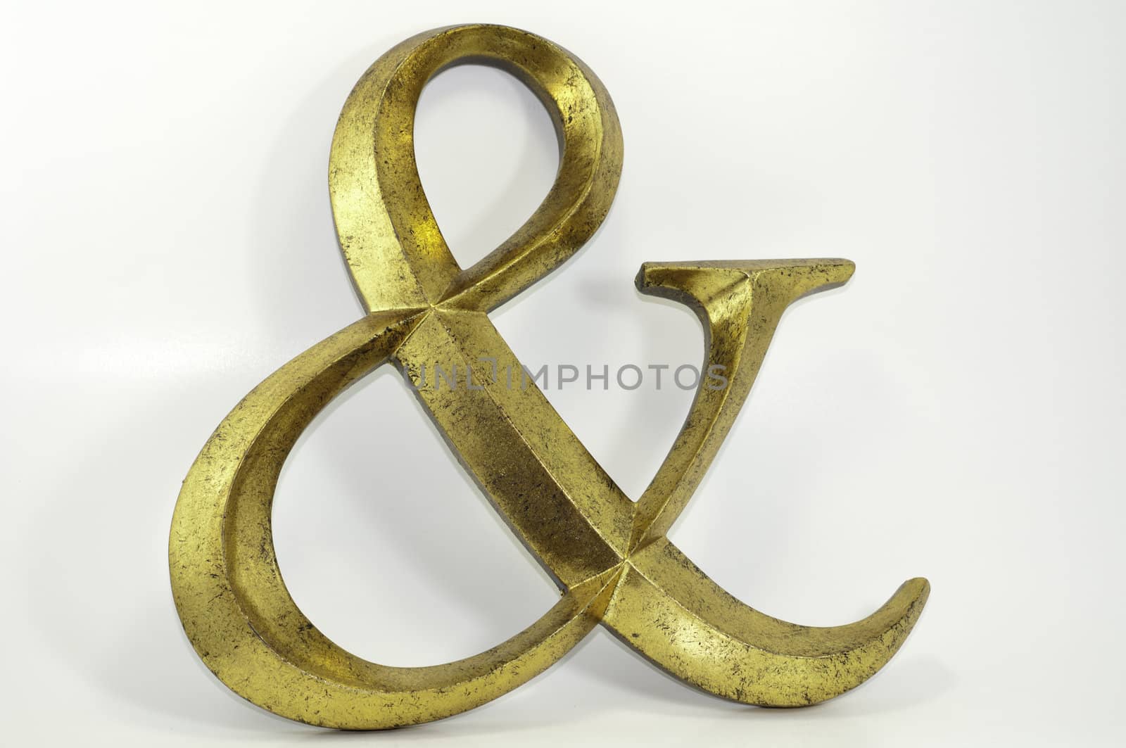 gold antiqued ampersand symbol decoration isolated on white background