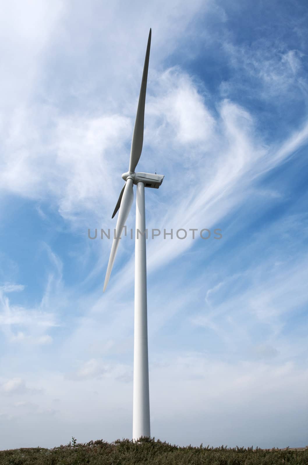 windmill with blue sky and white clouds