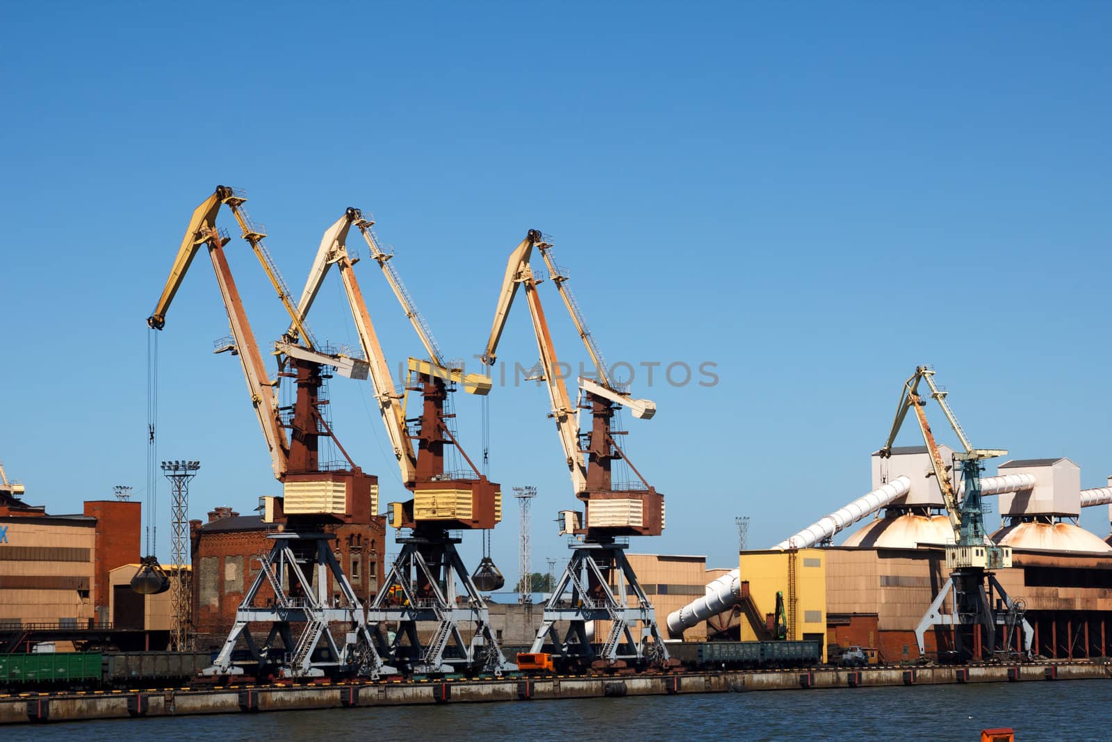 Cranes in dry cargo terminal at the port