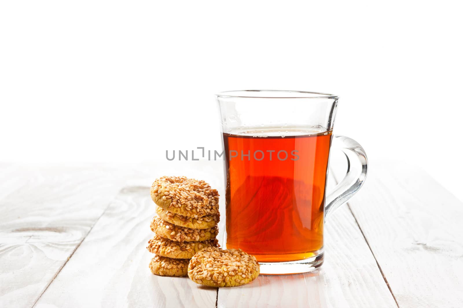 hot tea with cookies on wooden table