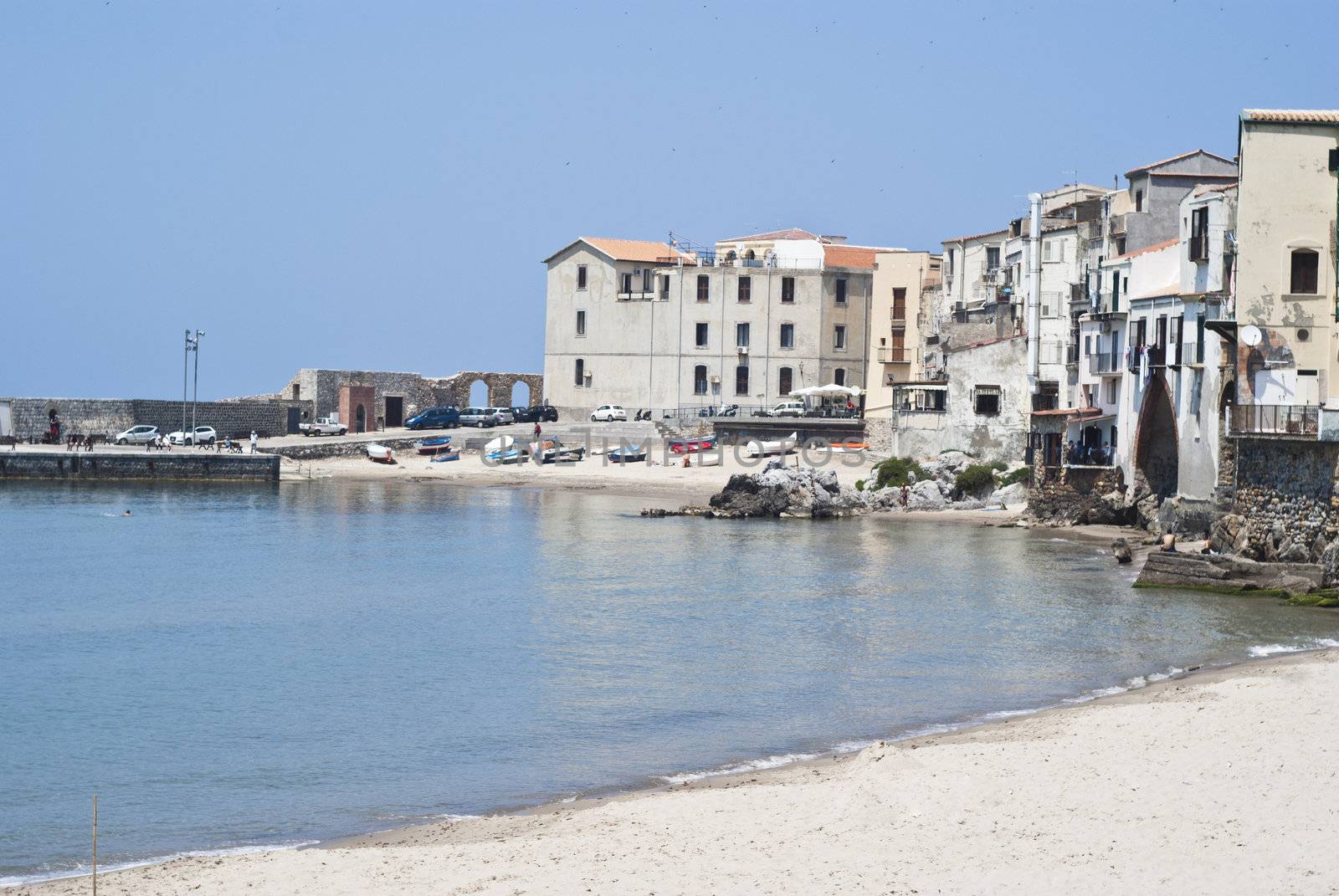 beach of Cefalu with centre city in the background. Sicily